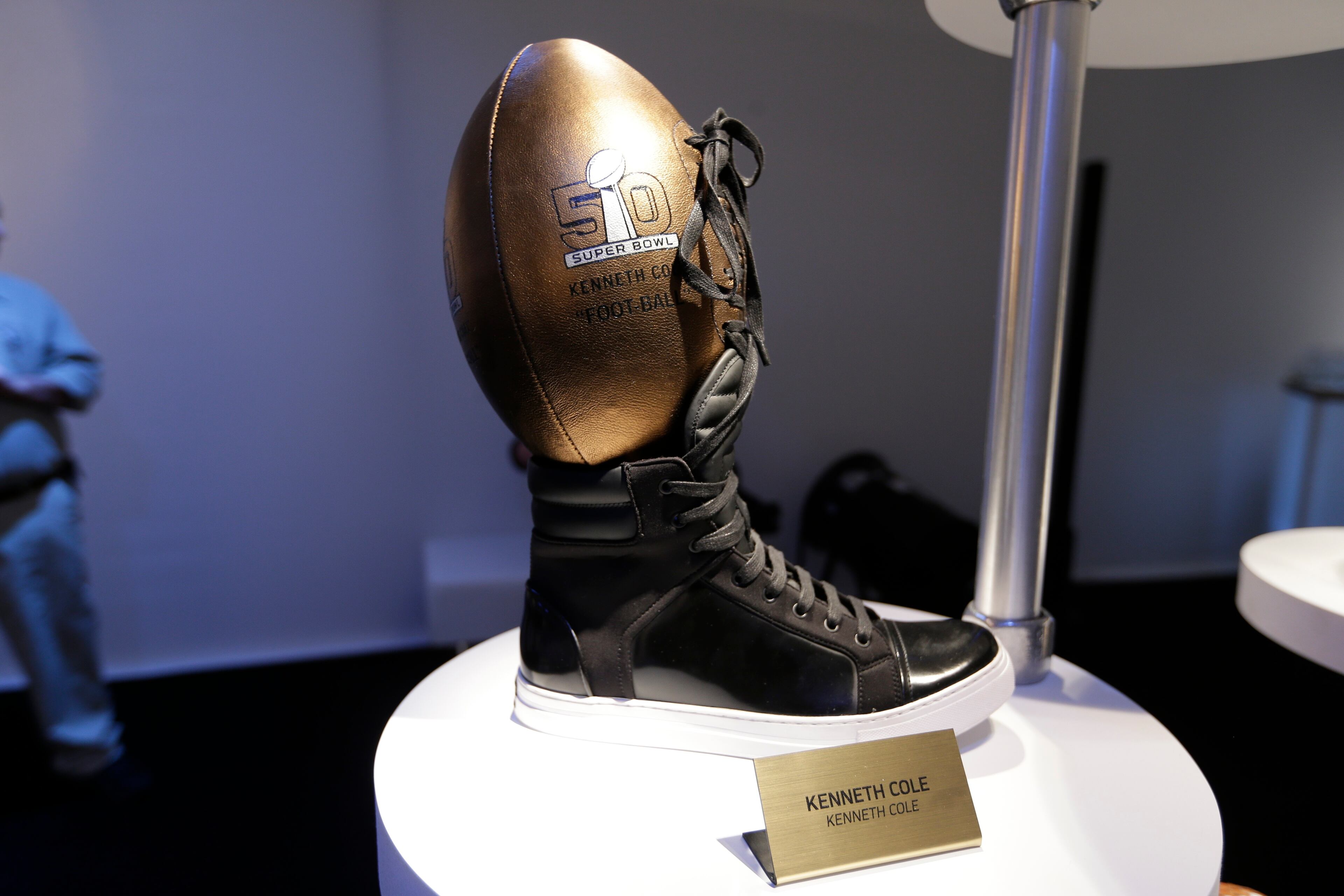 A Kenneth Cole designed football is displayed at the unveiling of the CFDA Footballs Wednesday, Jan. 20, 2016, at the NFL headquarters in New York. In celebration of Super Bowl 50 and in support of the NFL Foundation, the NFL and the Council of Fashion Designers of America have collaborated on 50 Bespoke Designer Footballs created by CFDA Members. (AP Photo/Frank Franklin II)