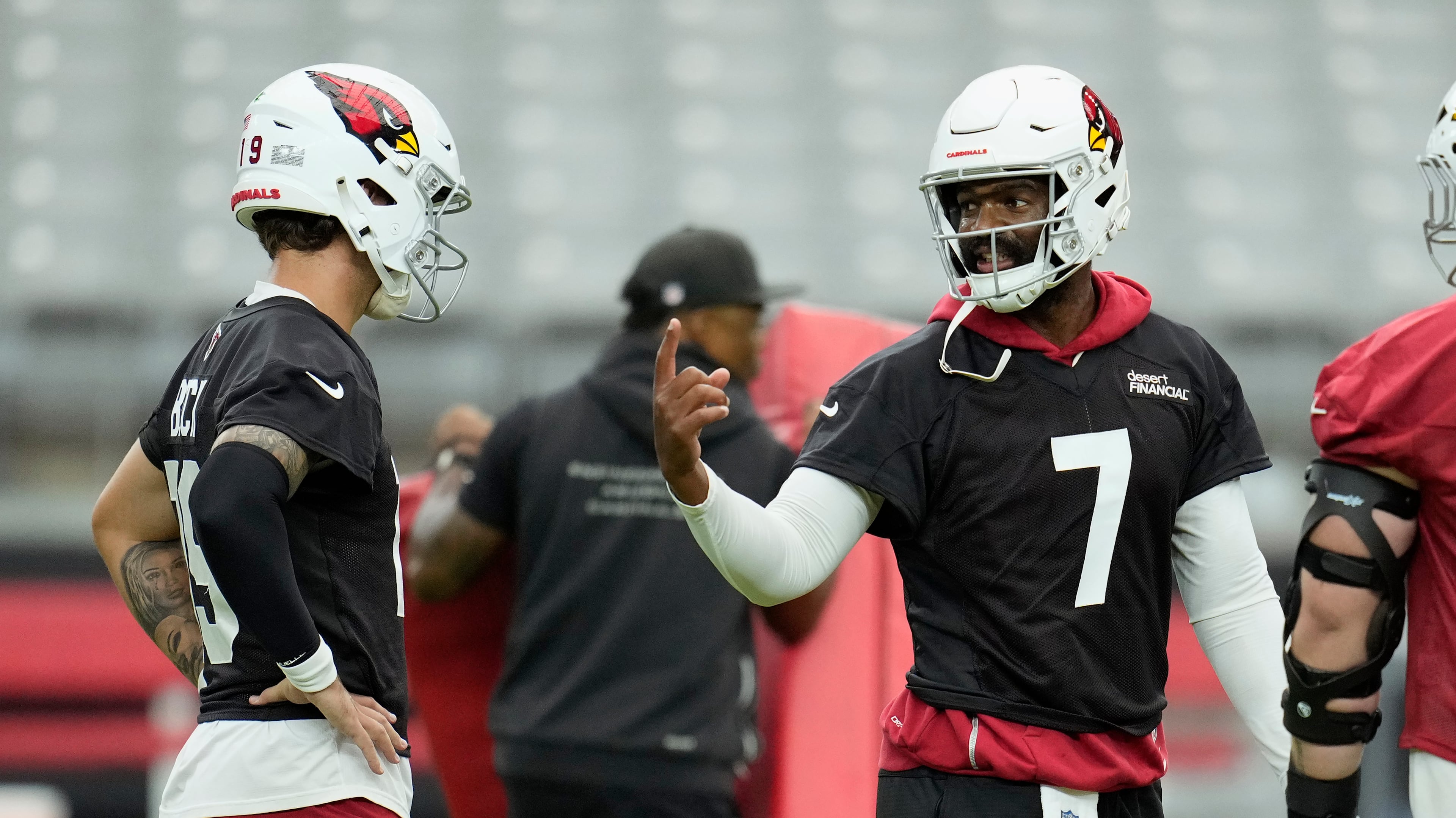 Arizona Cardinals quarterback Jacoby Brissett (7) talks with Cardinals quarterback Carson Beck, left, during NFL football training camp practice, Thursday, July 23, 2026, in Glendale, Ariz. (AP Photo/Ross D. Franklin)
