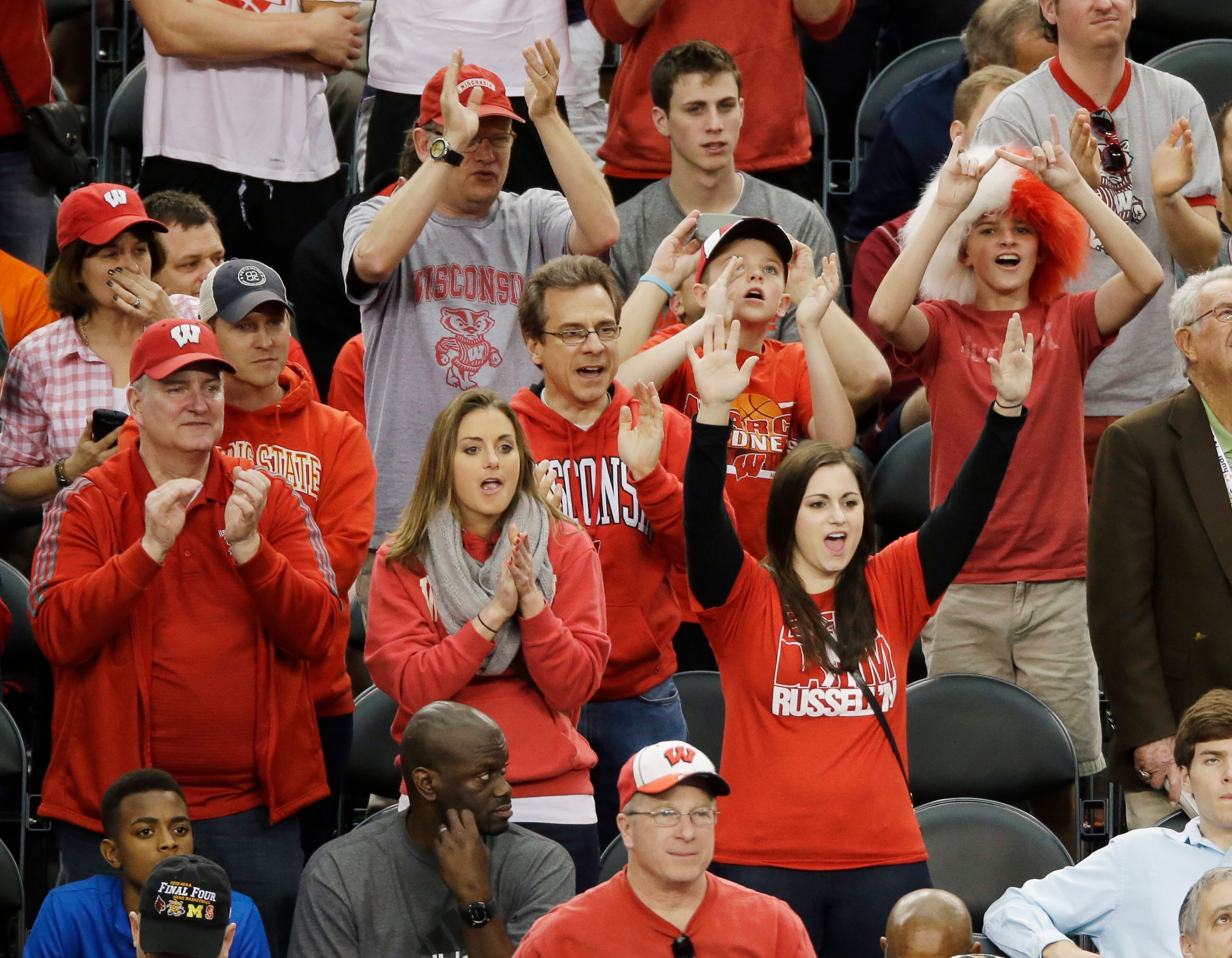 Wisconsin fans cheer during the team's practice for their NCAA Final Four tournament college basketball semifinal game Friday, April 4, 2014, in Dallas. Wisconsin plays Kentucky on Saturday, April 5, 2014. (AP Photo/Tony Gutierrez)