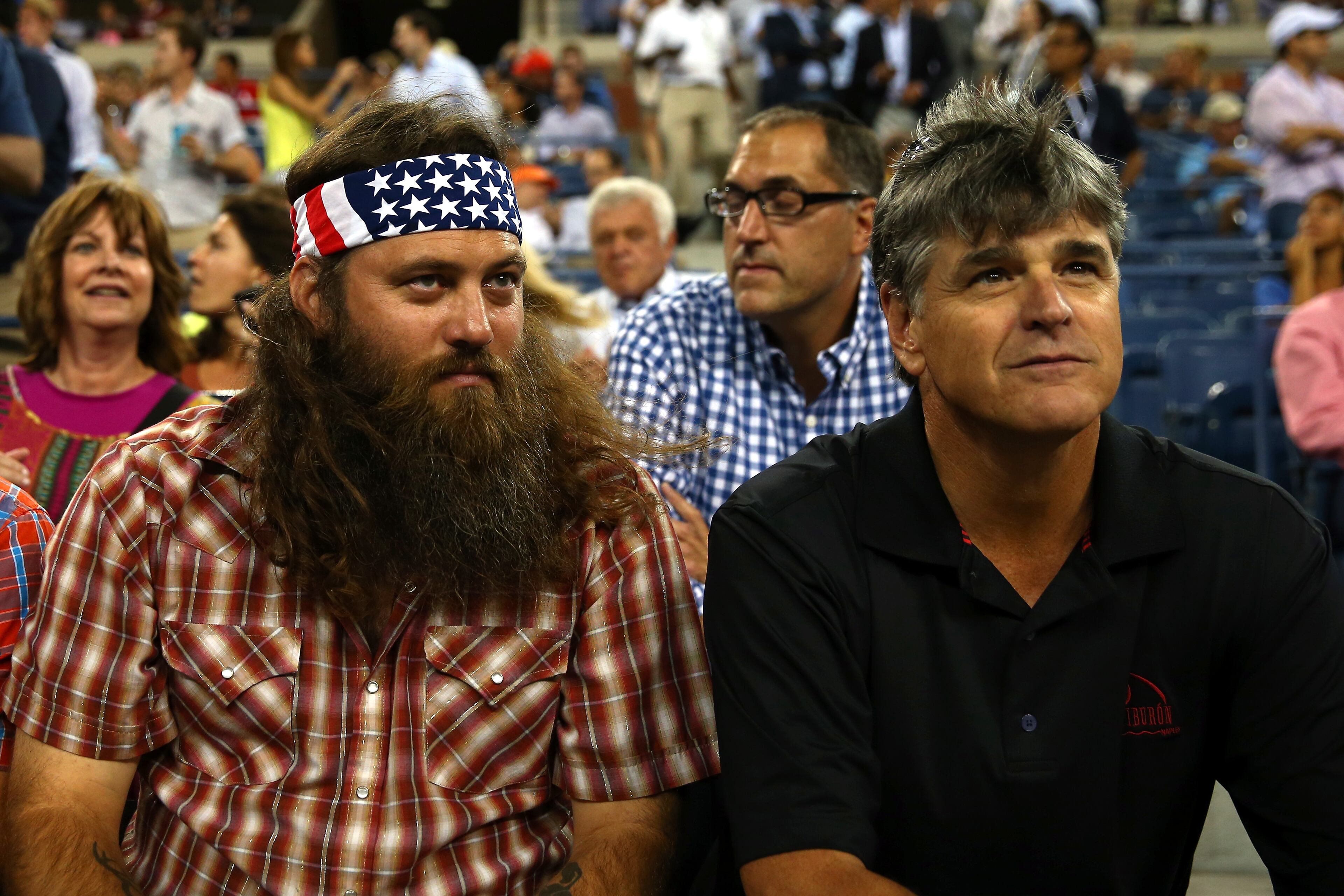 NEW YORK, NY - SEPTEMBER 04: (L-R) Duck Dynasty Willie Robertson and Fox News Channel's Sean Hannity attend Day Eleven of the 2014 US Open at the USTA Billie Jean King National Tennis Center on September 3, 2014 in the Flushing neighborhood of the Queens borough of New York City. (Photo by Elsa/Getty Images)
