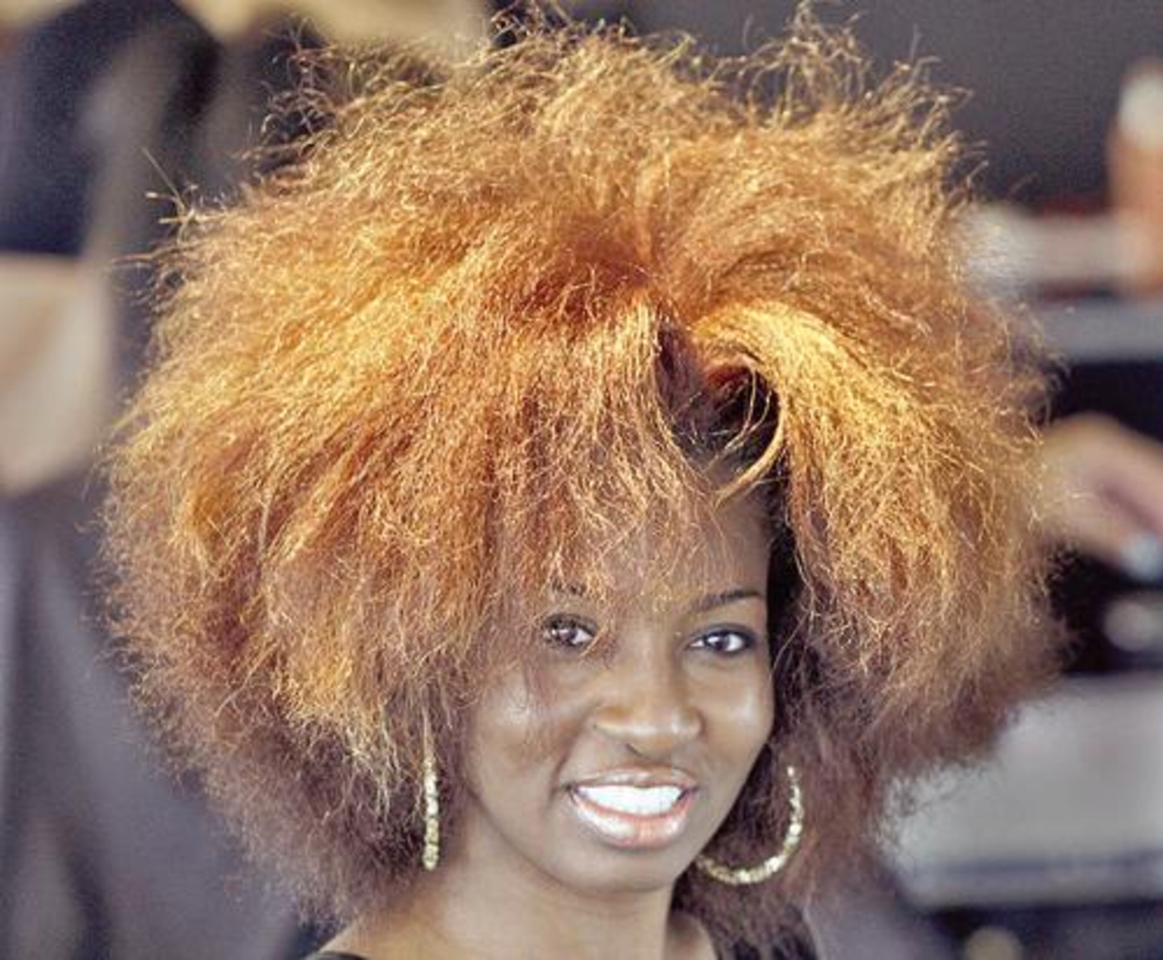 Lashima Tate before her styling at TAG Concept Salon. The latest revolution in black hair styles is a return to natural, non chemically processed, hair styles. TAG Concept Salon in Atlanta, only offers natural hair styles and has its own line of products.