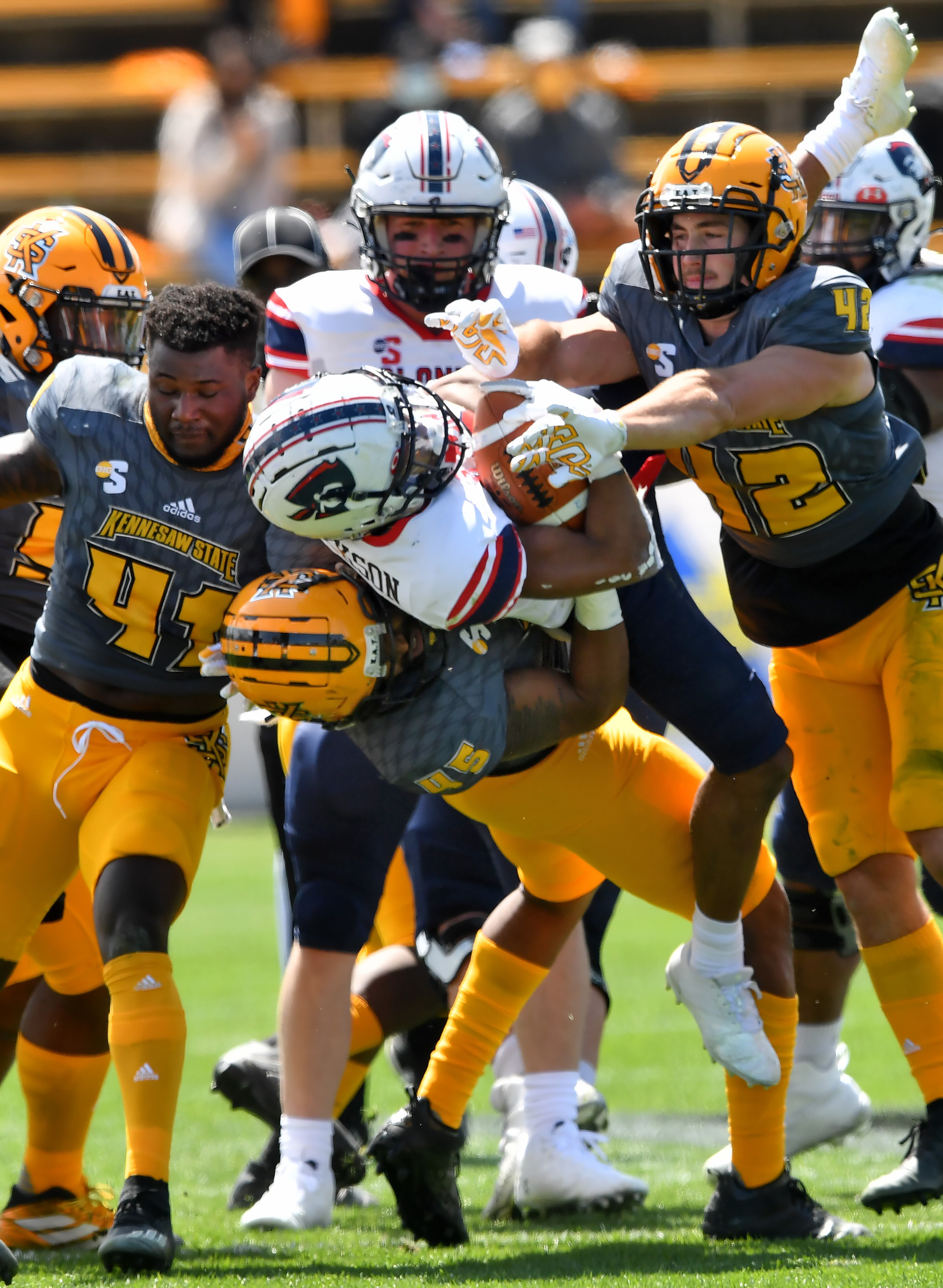 Kennesaw State's linebacker Xavier Reddick (45) takes down Robert Morris' running back Alijah Jackson (2) during a spring football game at Fifth Third Bank Stadium in Kennesaw. Kennesaw State won 35-0 over Robert Morris. (Hyosub Shin / Hyosub.Shin@ajc.com)