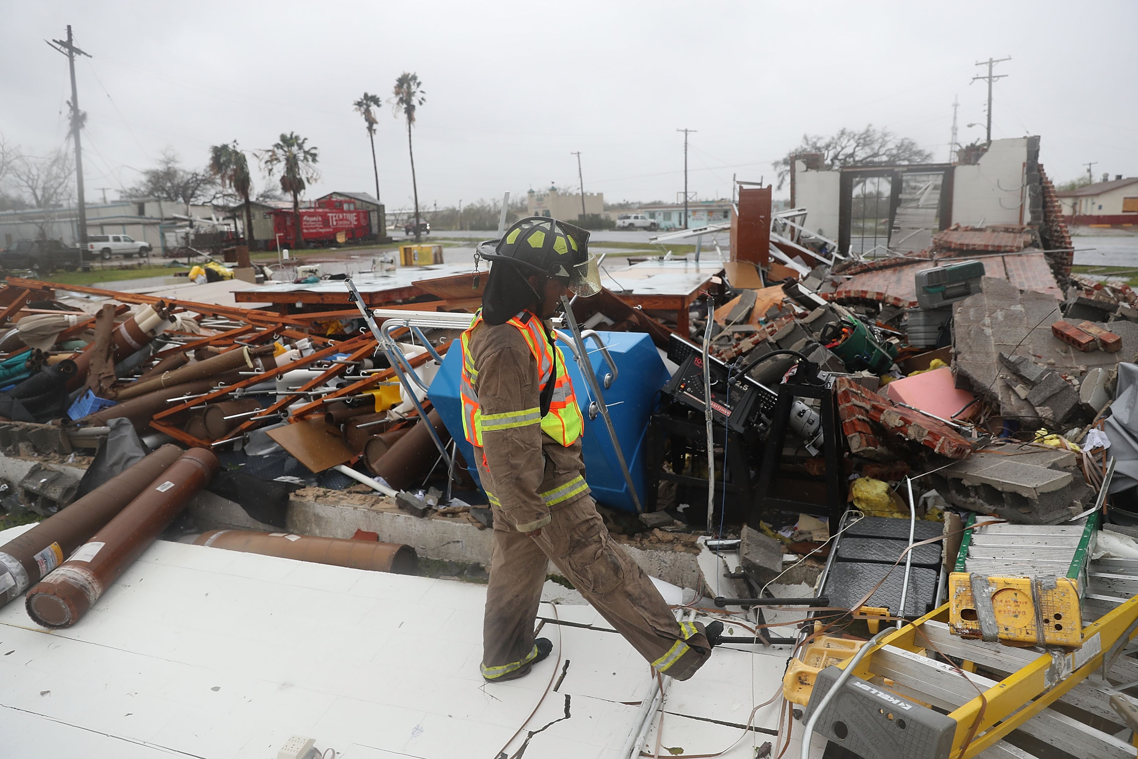 ROCKPORT, TX - AUGUST 26: A Rockport firefighter goes door to door on a search and rescue mission as he looks for people that may need help after Hurricane Harvey passed through on August 26, 2017 in Rockport, Texas. Harvey made landfall shortly after 11 p.m. Friday, just north of Port Aransas as a Category 4 storm and is being reported as the strongest hurricane to hit the United States since Wilma in 2005. Forecasts call for as much as 30 inches of rain to fall in the next few days. (Photo by Joe Raedle/Getty Images)