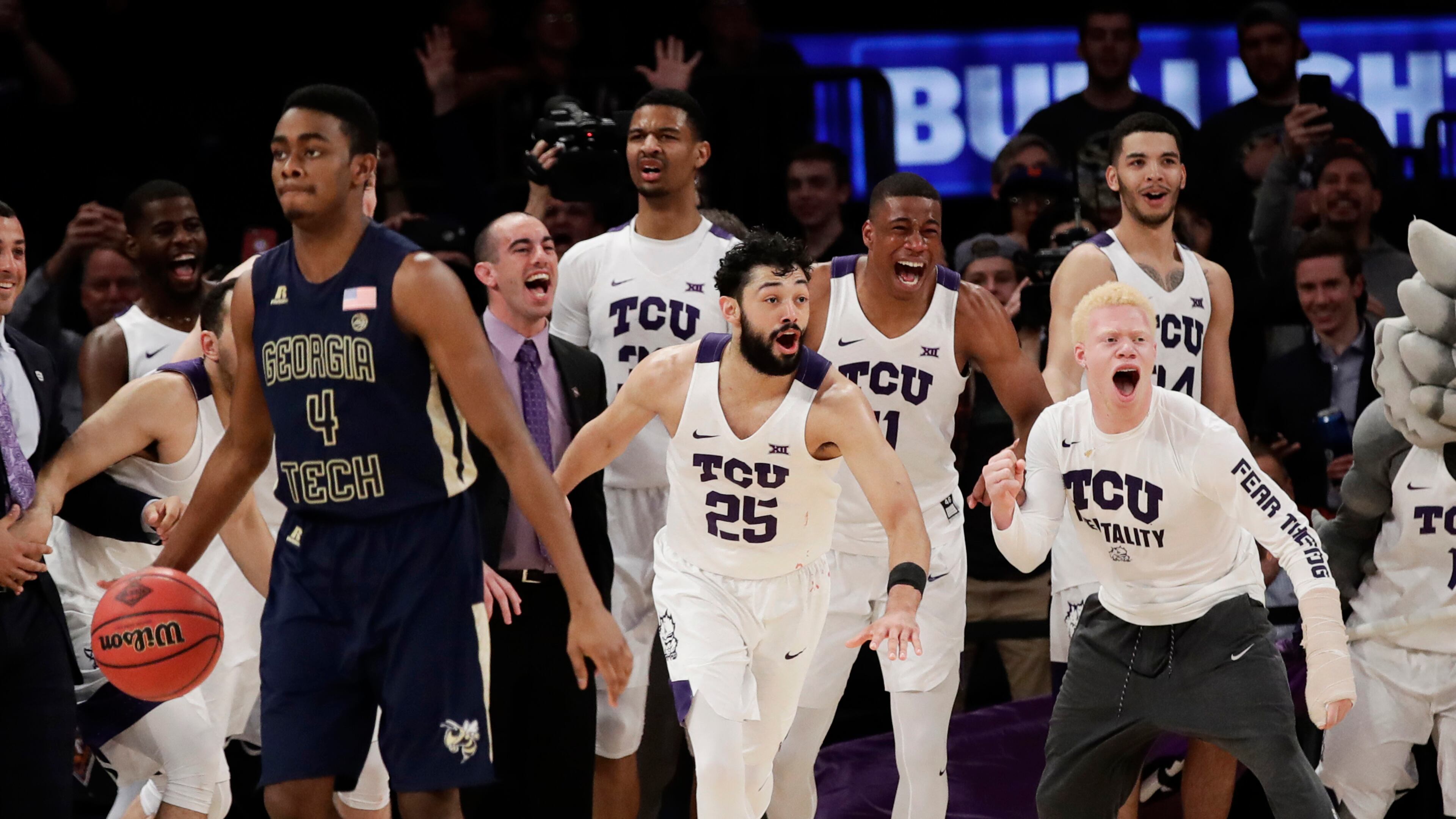 TCU celebrates as Georgia Tech’s Norman Harris (4) brings the ball down the court as time runs out in the second half of an NCAA college basketball game in the final of the NIT Thursday, March 30, 2017, in New York. (AP Photo/Frank Franklin II)
