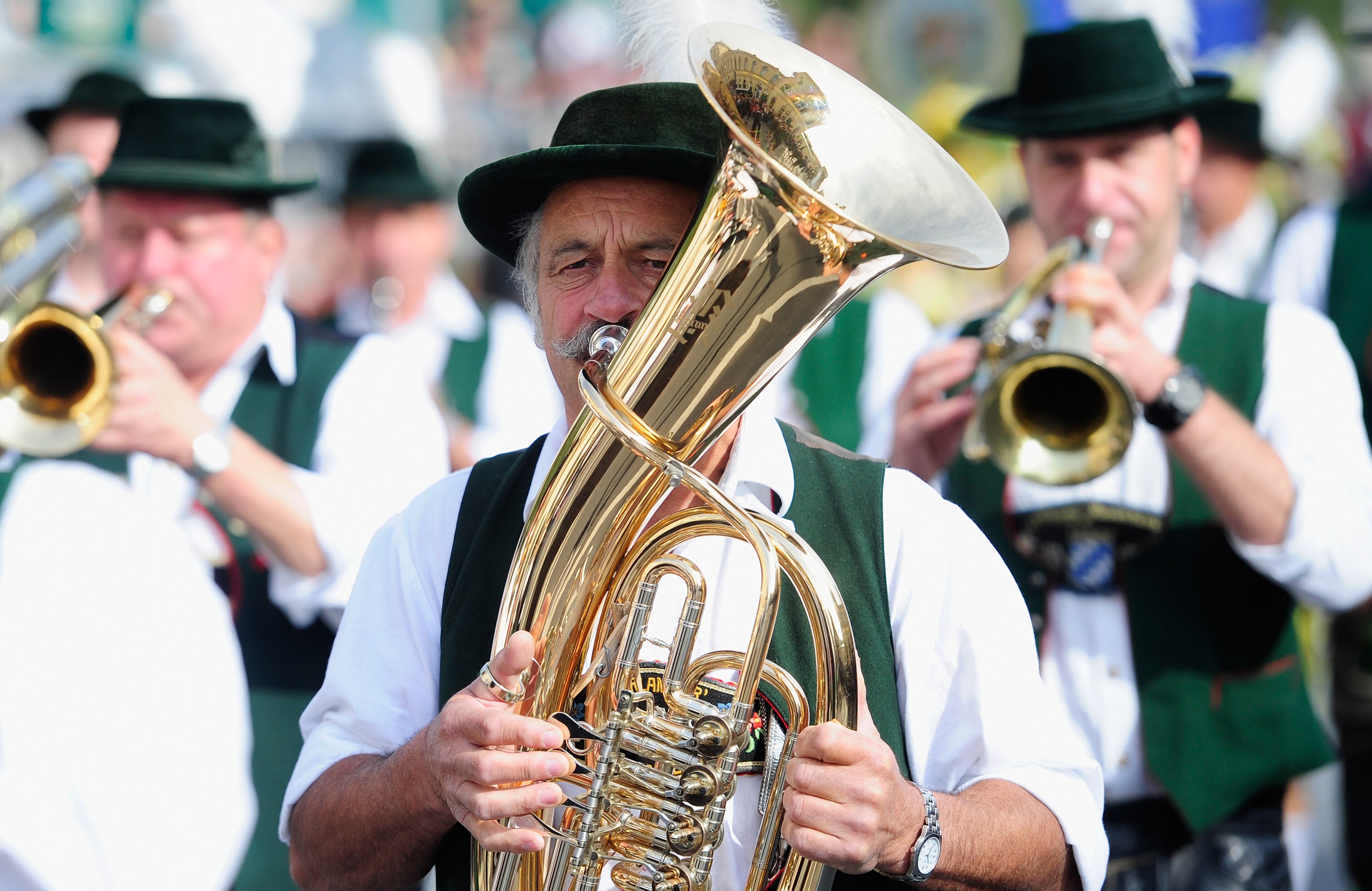 MUNICH, GERMANY - SEPTEMBER 22: Member of a brass band participate in the opening parade of the Oktoberfest 2013 beer festival at Odeonsplatz on September 22, 2013 in Munich, Germany. The Munich Oktoberfest, which this year will run from September 21 through October 6, is the world's largest beer fest and draws millions of visitors. (Photo by Lennart Preiss/Getty Images)