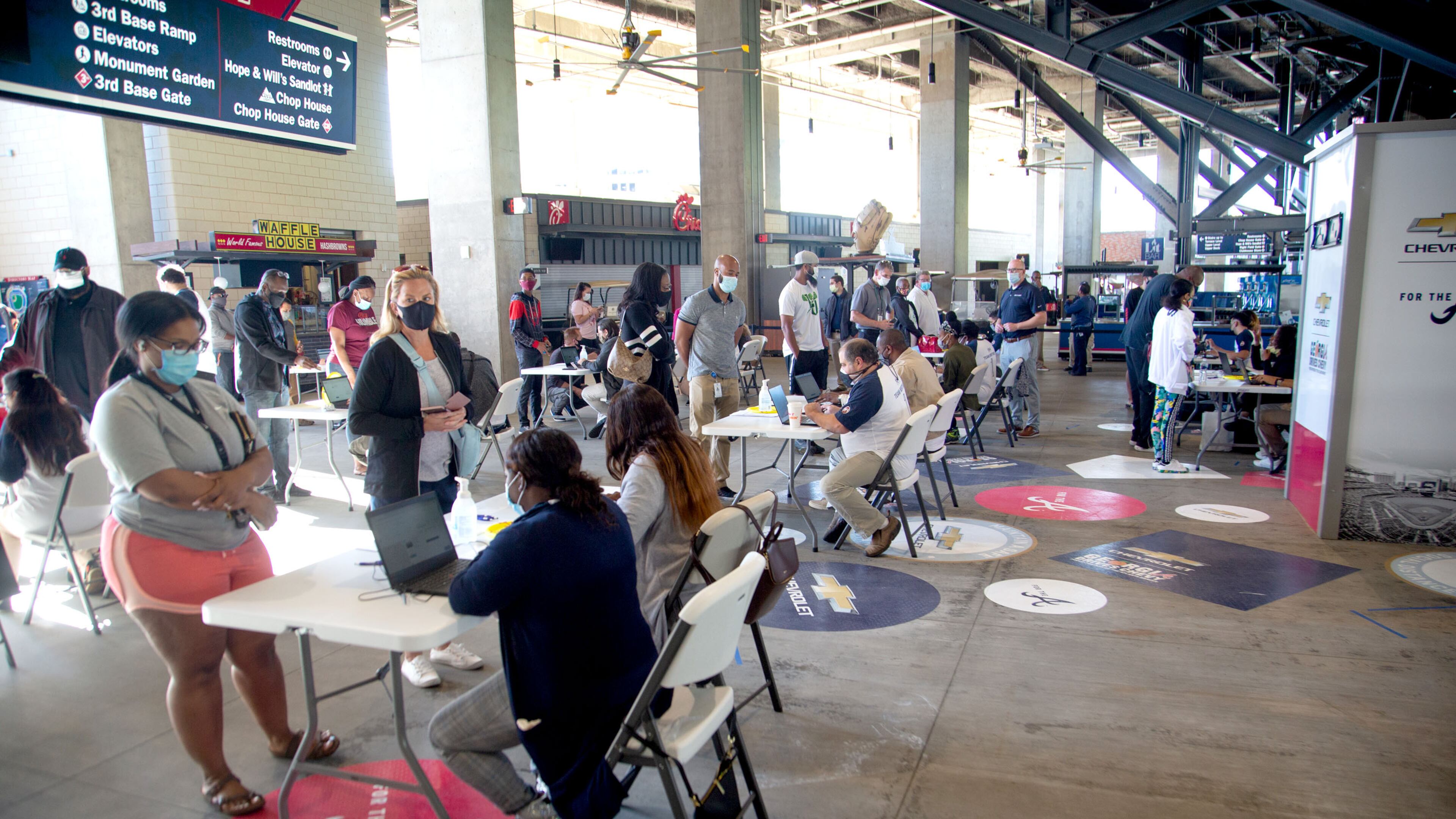 Deaths from COVID-19 have plunged in Georgia due to the early success of vaccination campaigns, experts say. Earlier this week, people lined up at a free vaccination clinic at Truist Park sponsored by the Atlanta Braves. (Photo: Steve Schaefer for The Atlanta Journal-Constitution)
