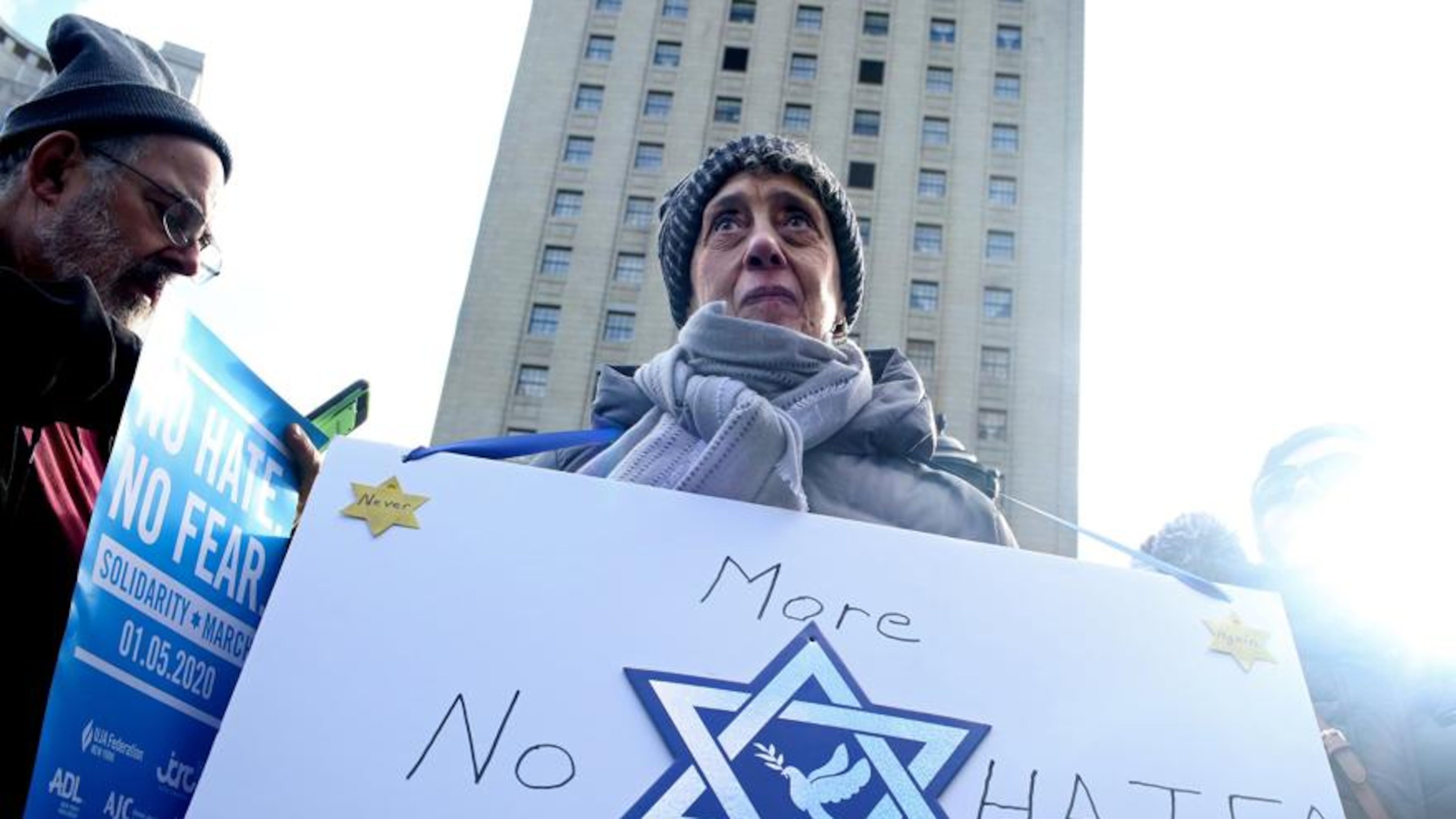 Margo Litwin joins others in a Jan. 5 march across the Brooklyn Bridge to support the city’s Jewish communities in the wake of a spate of anti-Semitic attacks, in New York. Thousands of people, some covered in Israeli flags and others singing Hebrew songs, poured into Lower Manhattan on Sunday in a show of solidarity. YANA PASKOVA/THE NEW YORK TIMES