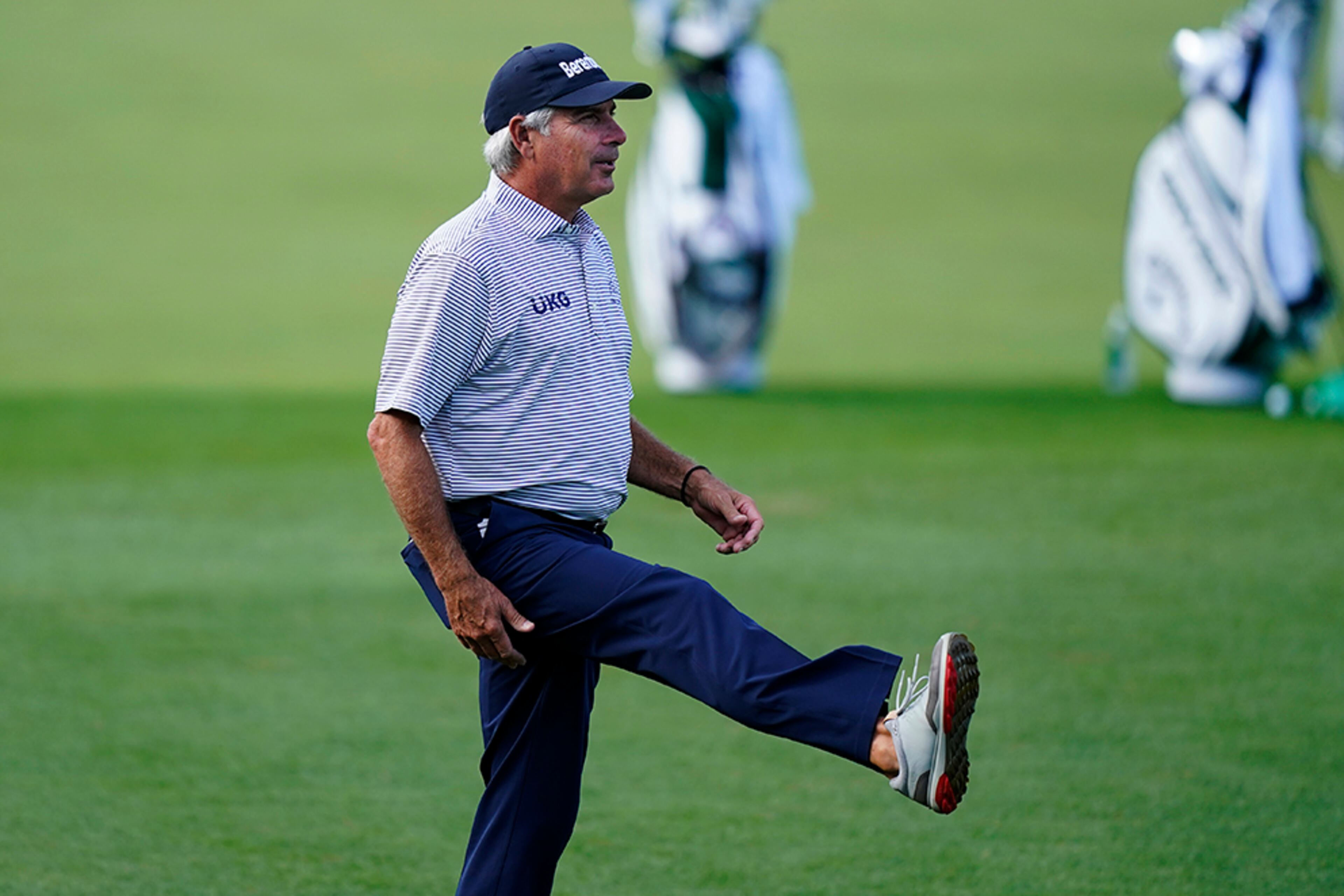 Fred Couples stretches on the driving range during a practice round for the Masters Tournament Monday, Nov. 9, 2020, in Augusta, Ga. (David J. Phillip/AP)