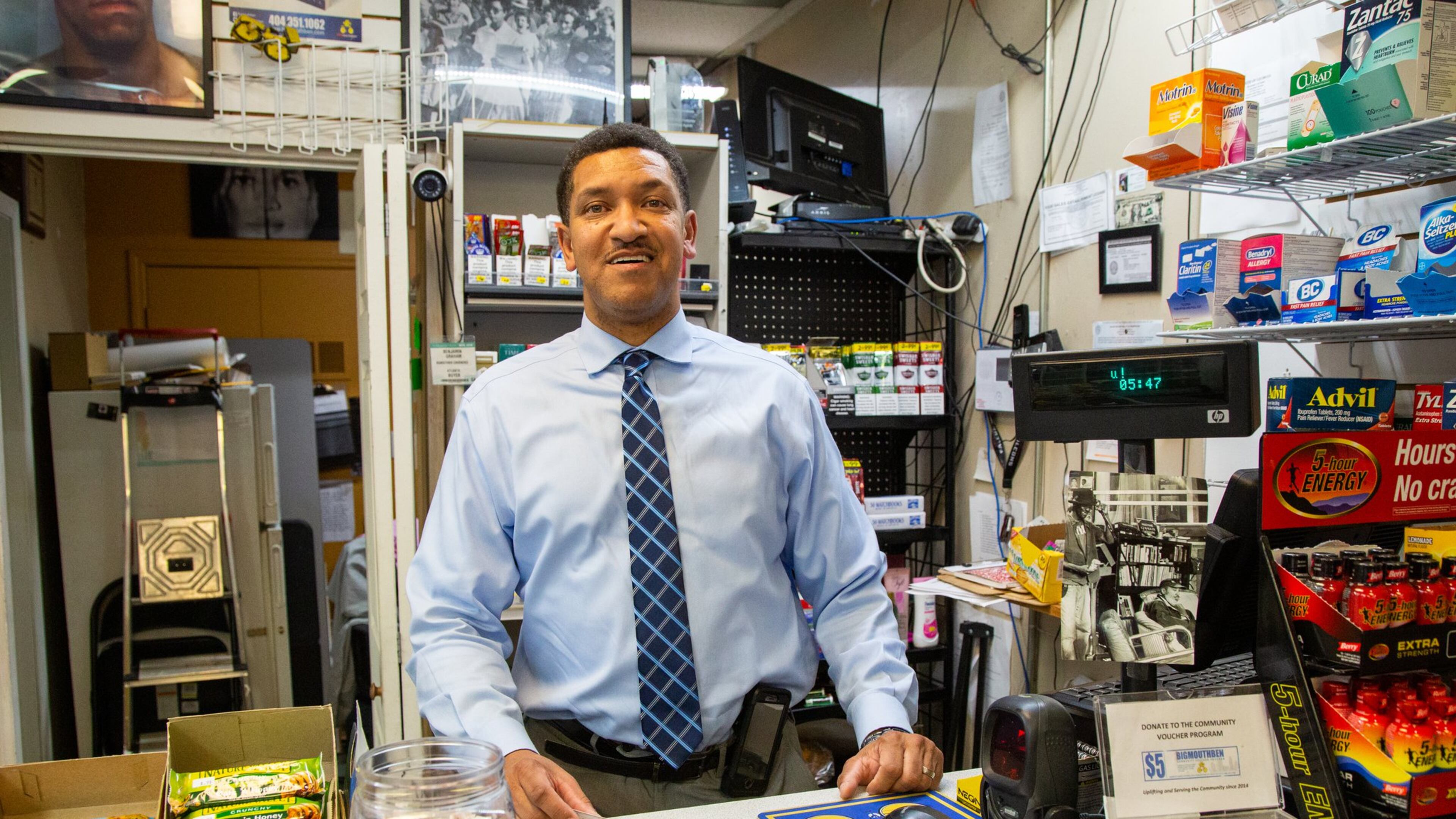 Ben Graham was a drug addict for 17 years and lived under the bridges on Auburn Ave before turning his life around. Now he owns the Big-Mouth Ben Convenience store on Auburn Ave & he is a motivational entertainer/speaker. He has a yellow bike in front of the store with an invitation to come inside & hear his story. (Photo by Phil Skinner)
