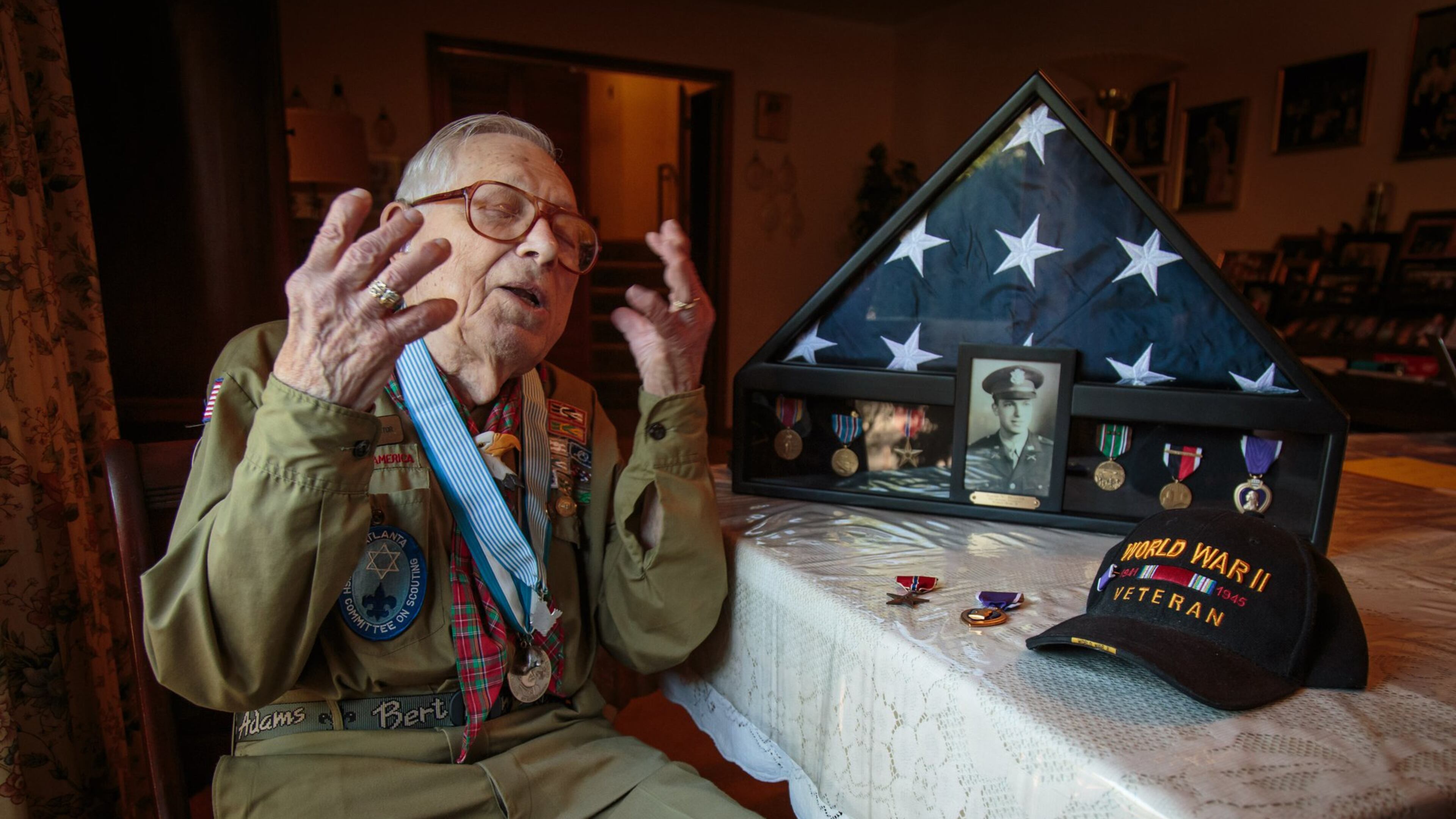 Josiah Benator talks about his time as a WWII soldier and his 60 plus years as a scoutmaster at his Atlanta home Friday, April 7, 2017. Benator received a Purple Heart and a Bronze Star Medal while serving in the WWII, and as a scoutmaster, he has overseen 53 Boy Scouts as they received their Eagle Scout rank. STEVE SCHAEFER / SPECIAL TO THE AJC