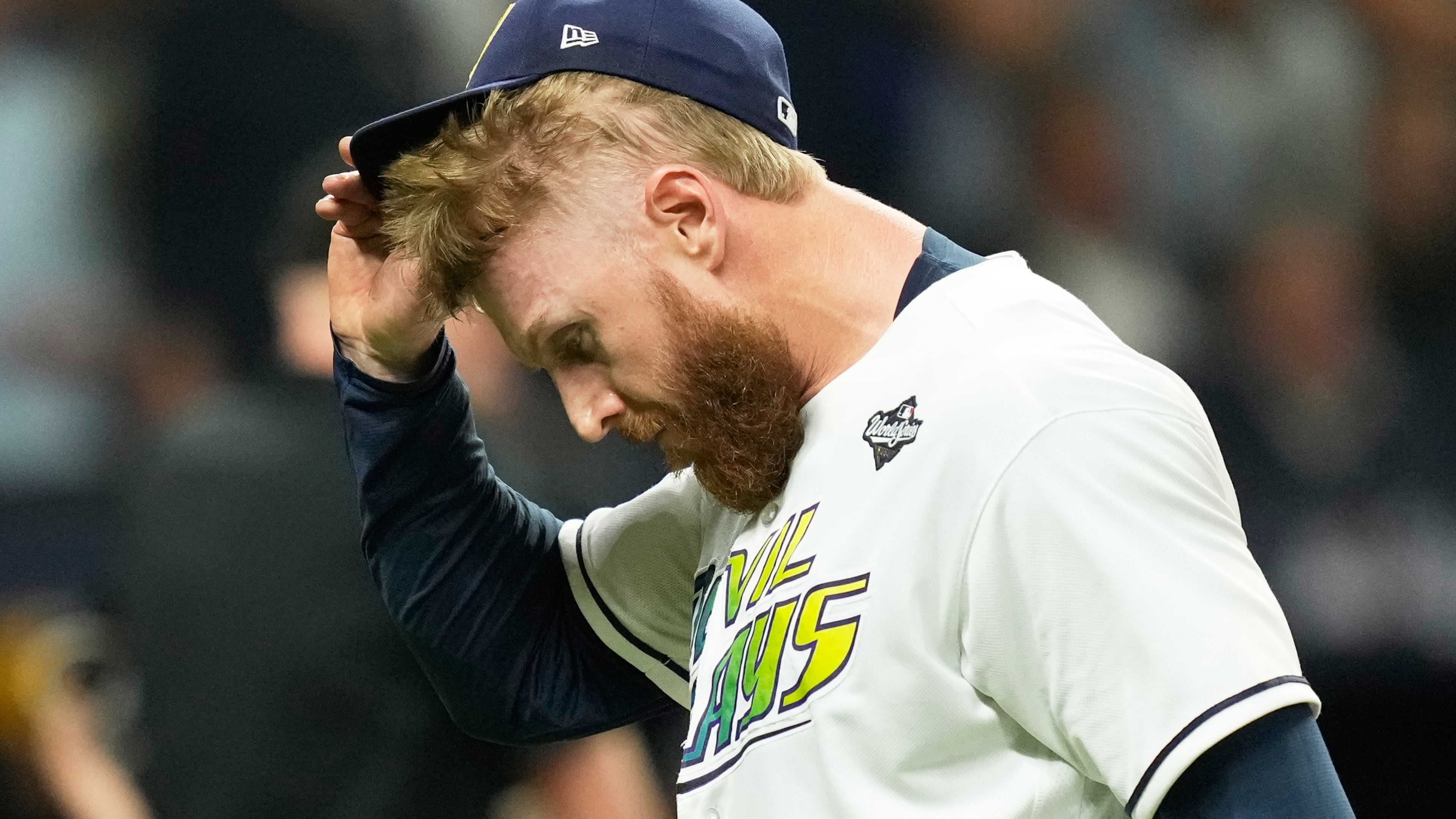 Tampa Bay Rays pitcher Cam Booser leaves the game during the fifth inning of Game 3 of baseball's World Series, Monday, Oct. 26, 2026, in St. Petersburg, Fla., between the Milwaukee Brewers and the Tampa Bay Rays. (AP Photo/Ashley Landis)