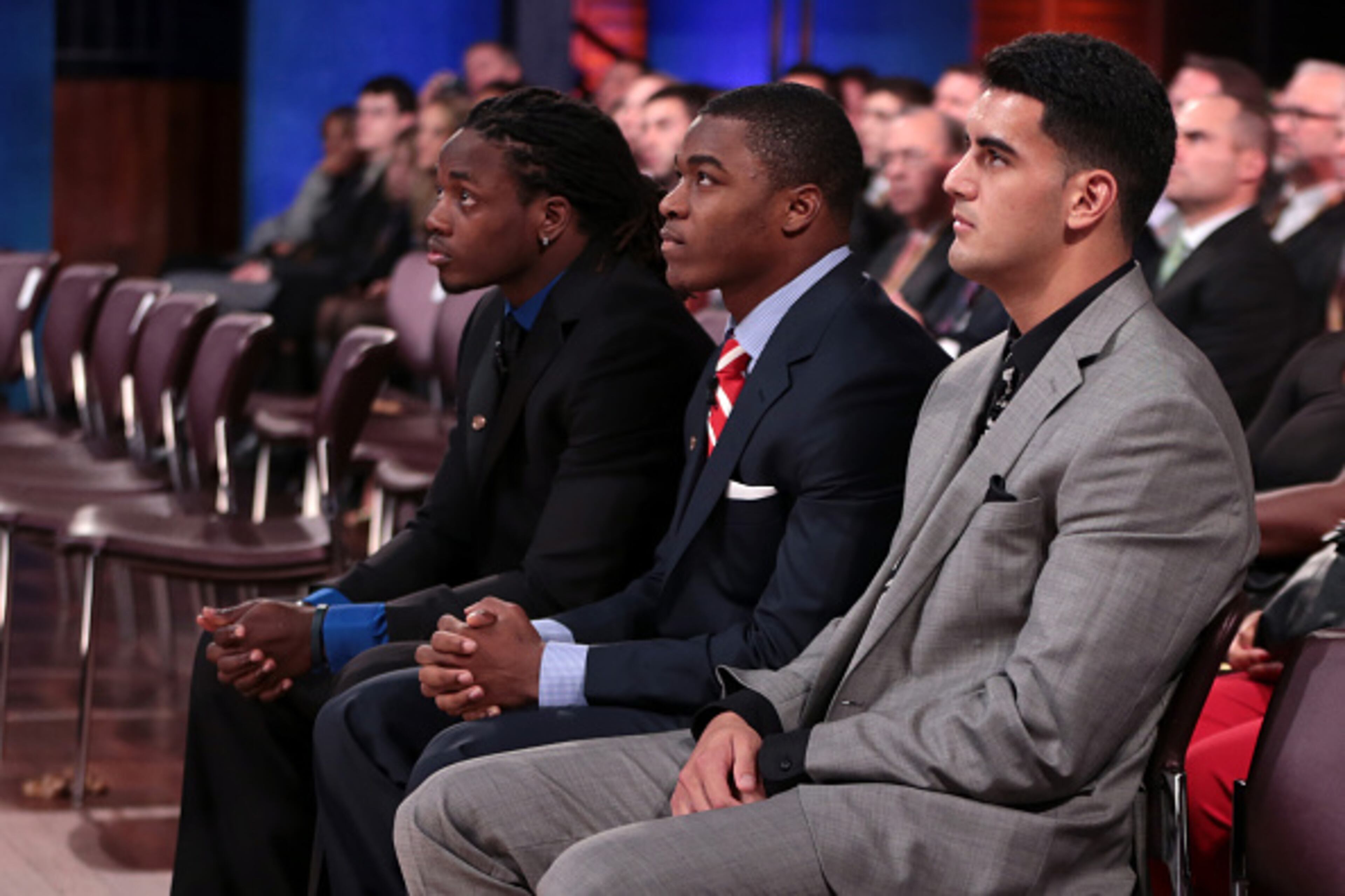 NEW YORK, NY - DECEMBER 13: (L-R)Melvin Gordon, quarterback for the University of Wisconsin Badgers, Amari Cooper, wide receiver for the University of Alabama Crimson Tide, and Marcus Mariota, quarterback for the University of Oregon Ducks, look on prior to being named the 80th Heisman Memorial Trophy Award winner during the 2014 Heisman Trophy Presentation at the Best Buy Theater on December 13, 2014 in New York City. NOTE TO USER: Photographer approval needed for all Commercial License requests. (Photo by Kelly Kline/Getty Images for The Heisman)