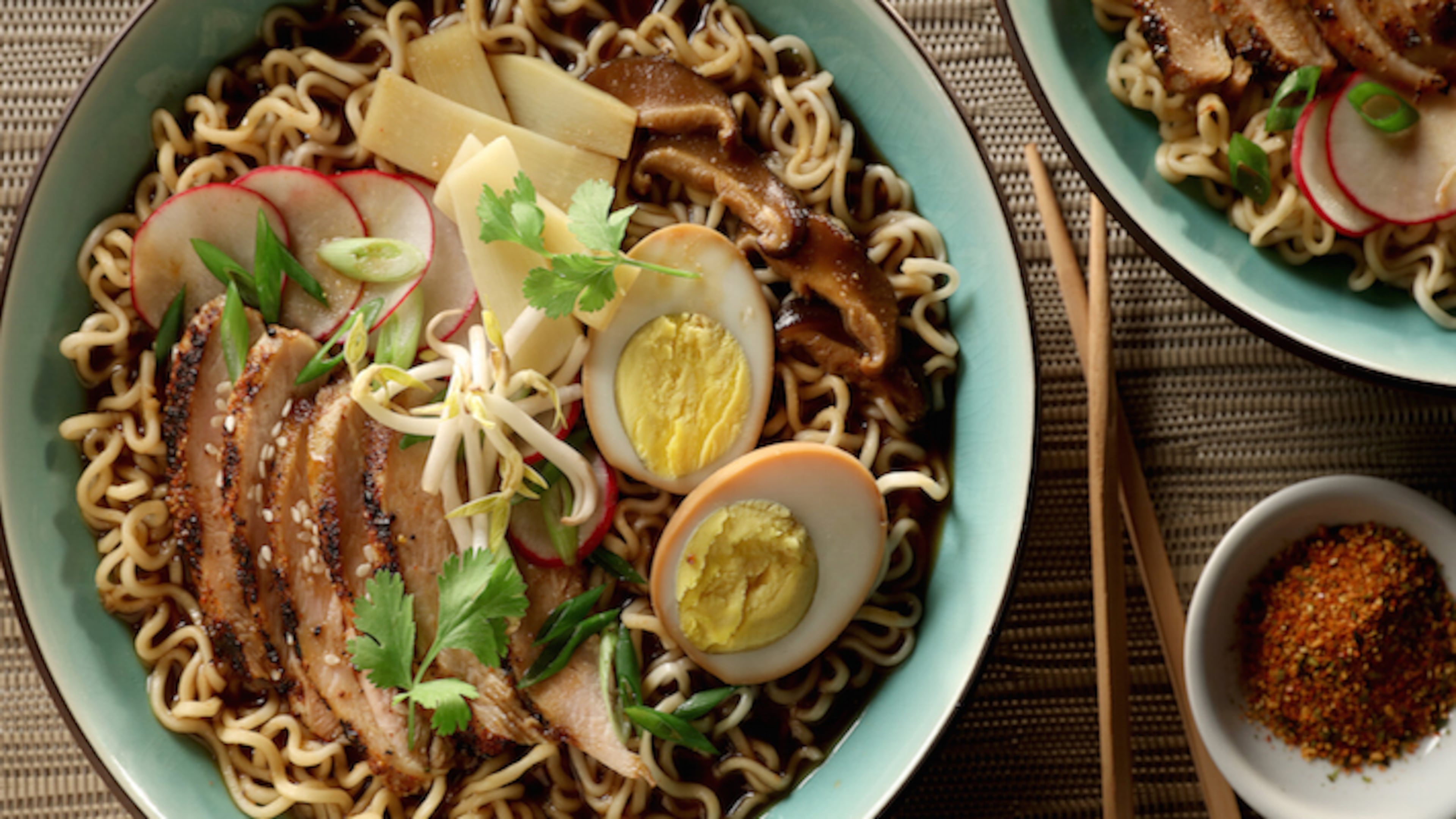 Grilled shichimi togarashi-flavored chicken and soy-wasabi hard-cooked eggs bolster homemade ramen. (Michael Tercha/Chicago Tribune/TNS)