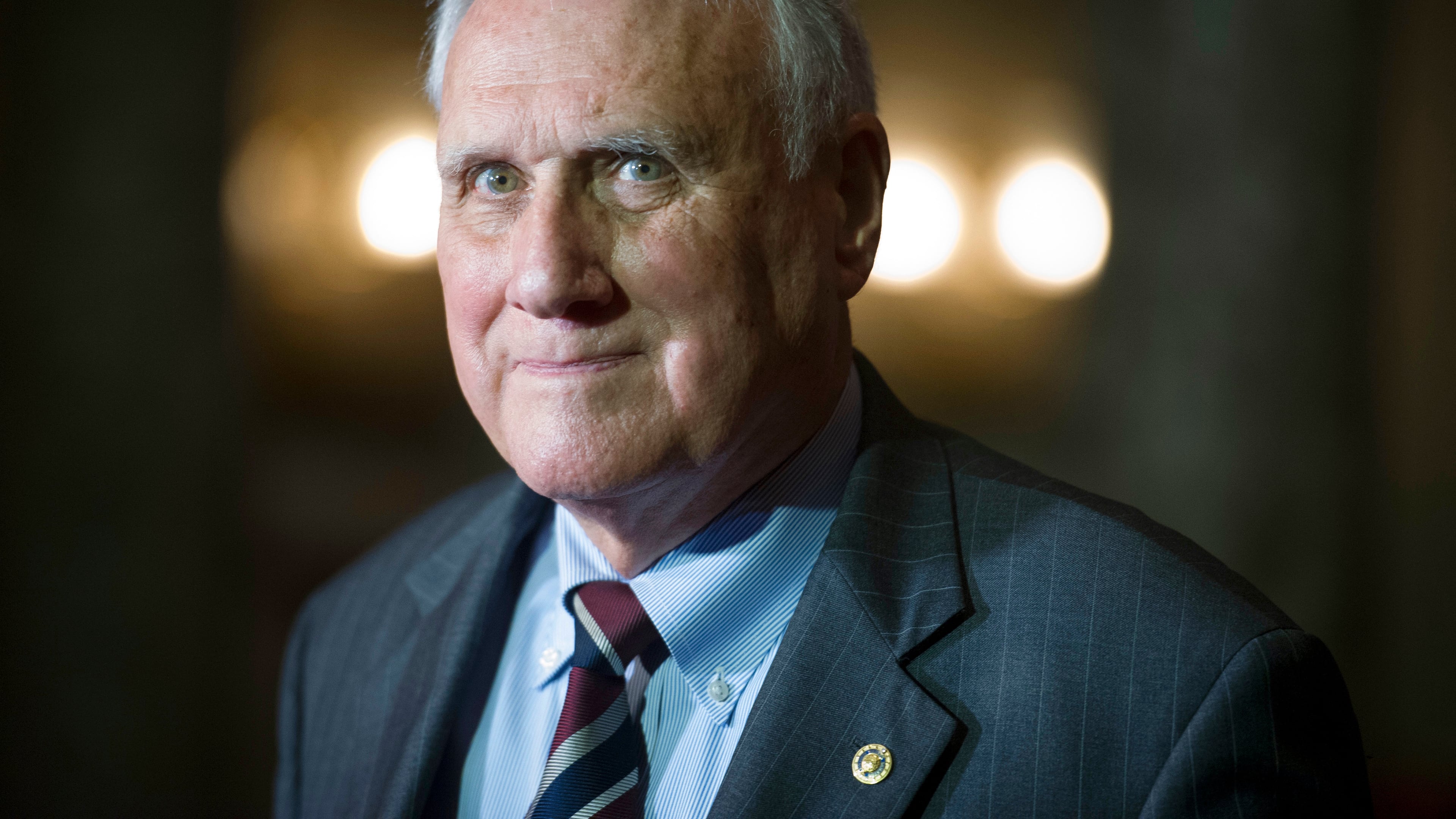 FILE - Sen. Jon Kyl, R-Ariz., waits to be sworn-in by Vice President Mike Pence during his ceremonial swearing-in at the Old Senate Chamber on Capitol Hill, in Washington, Sept. 5, 2018. (AP Photo/Cliff Owen, File)