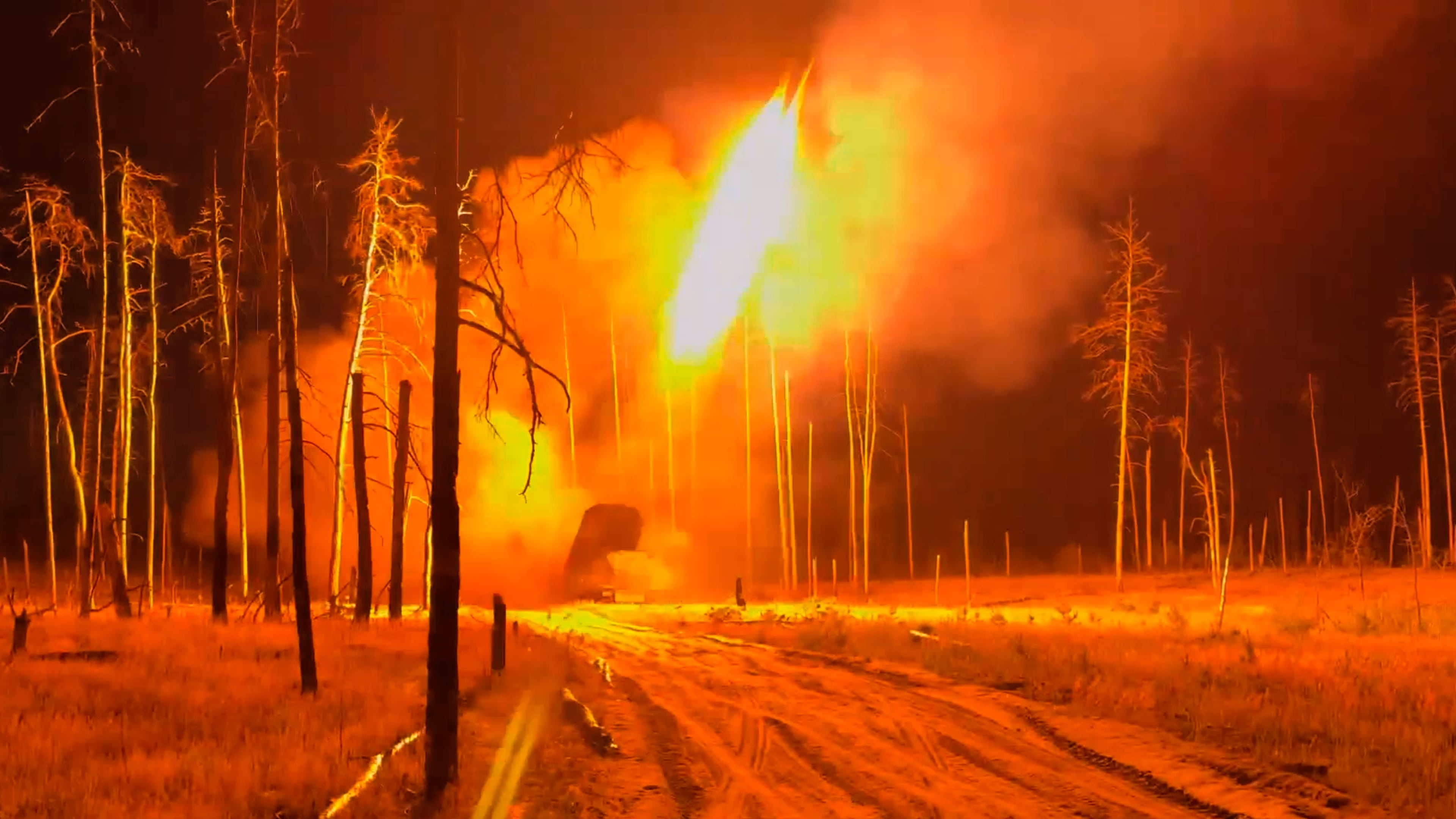 In this image made from video provided by Russian Defense Ministry Press Service on Tuesday, June 30, 2026, Russian TOS-1 Solntsepyok heavy flamethrower rocket launcher fires towards the Ukrainian positions. (Russian Defense Ministry Press Service via AP)