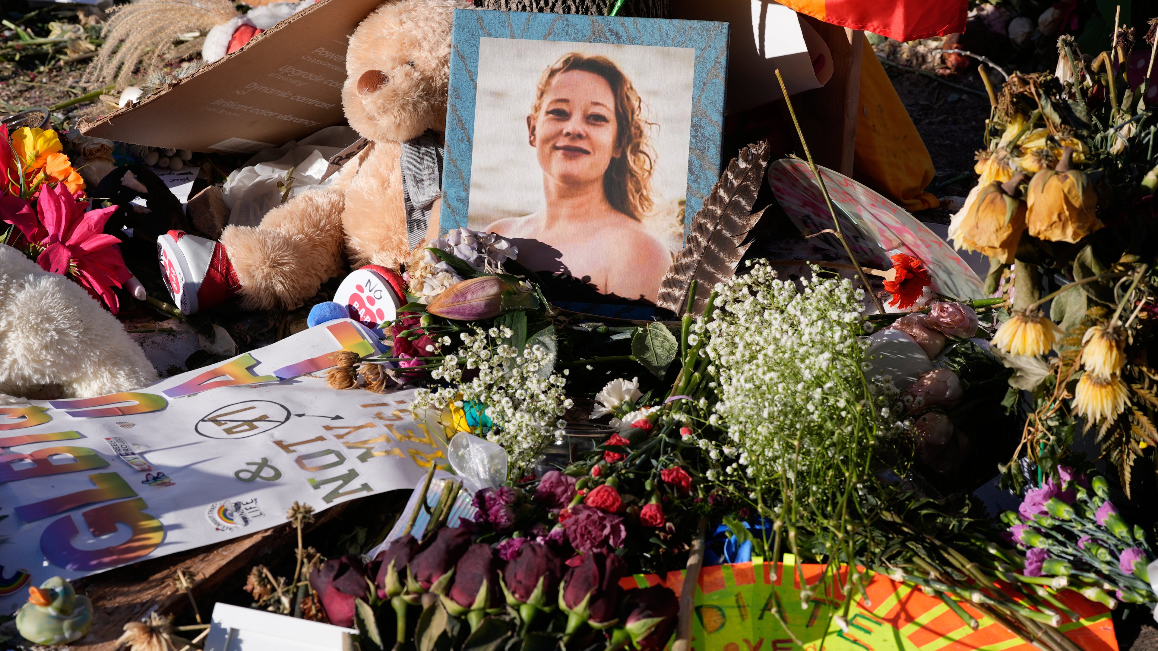 FILE - Flowers and photos are left at a memorial site for Renee Good on Saturday, Jan. 31, 2026, in Minneapolis. (AP Photo/Alex Brandon, File)