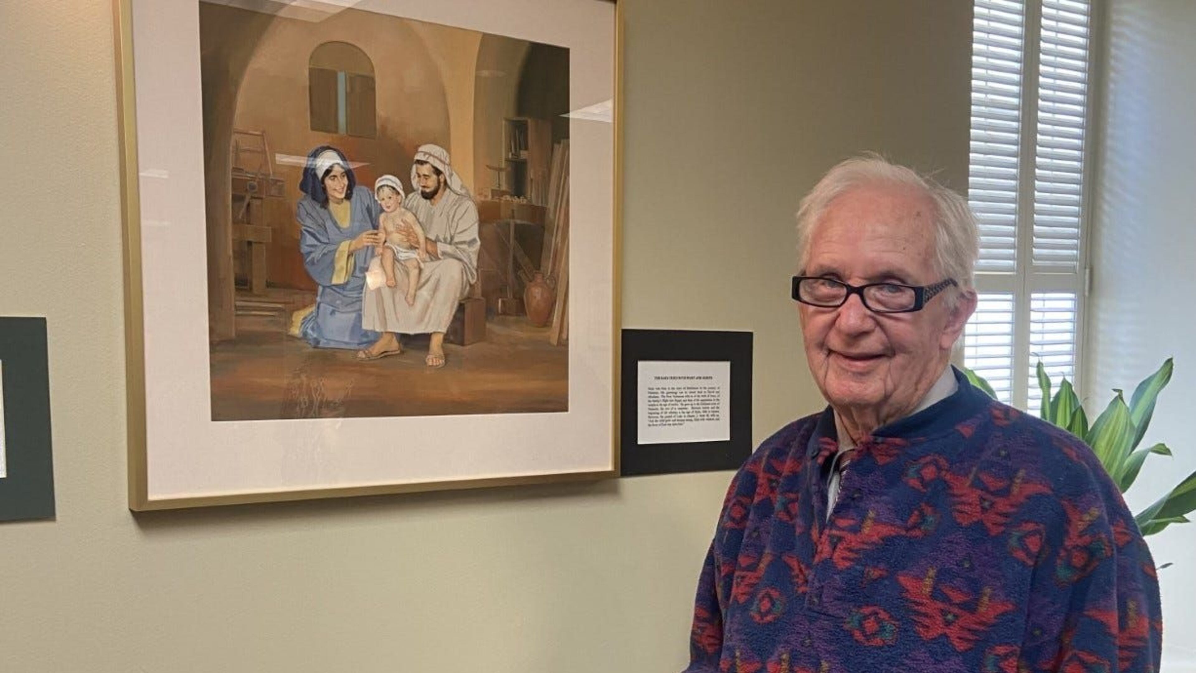 John Nelson next to one of his pieces.
