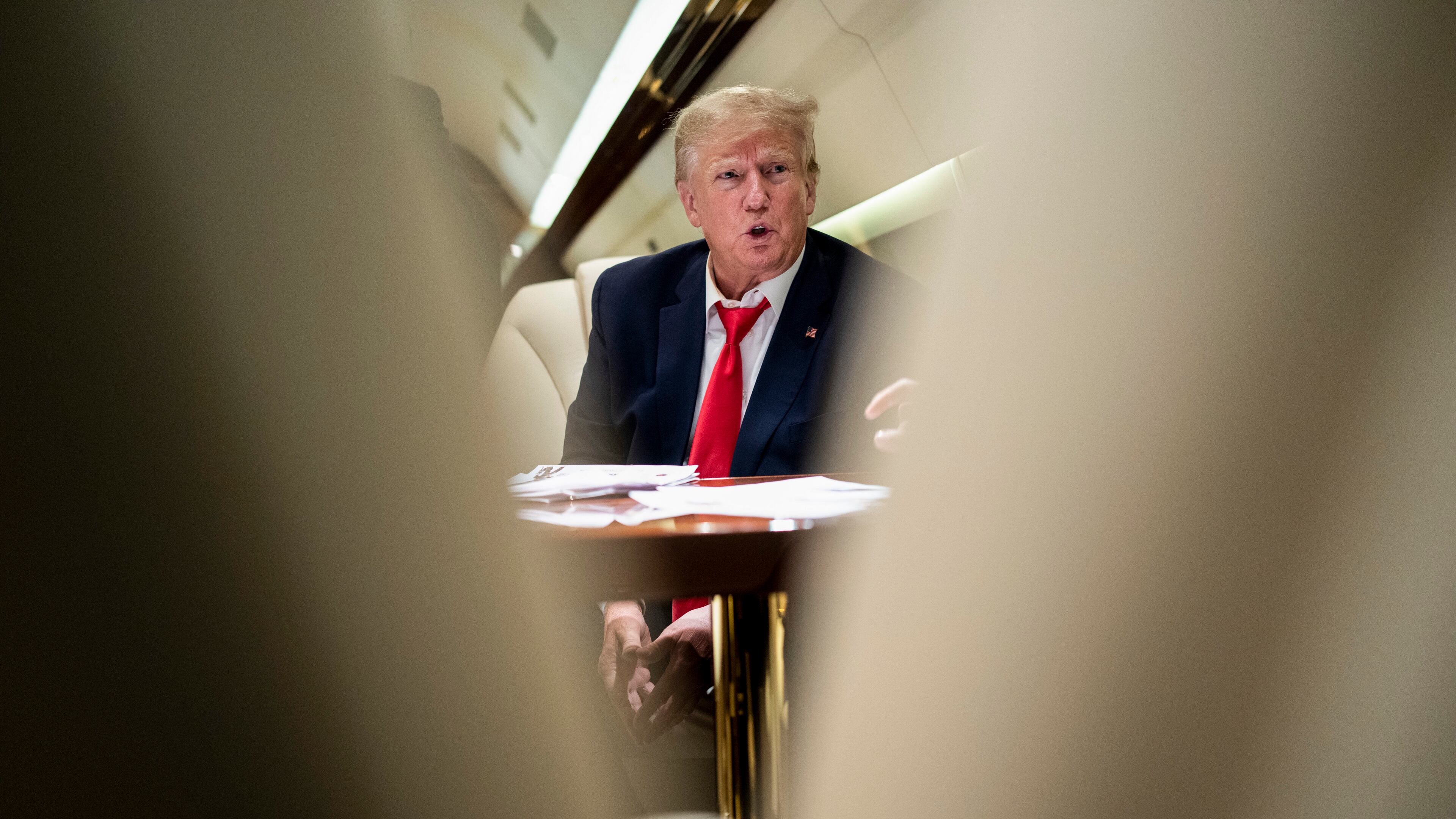 FILE — Former President Donald Trump on his plane flying to Columbia, S.C., for a stop in his 2024 campaign, on Jan. 28, 2023. The indictment unveiled on Tuesday, Aug. 1, 2023, accused Trump of enlisting six co-conspirators in “his criminal efforts to overturn the legitimate results of the 2020 presidential election and retain power.” (Doug Mills/The New York Times)
