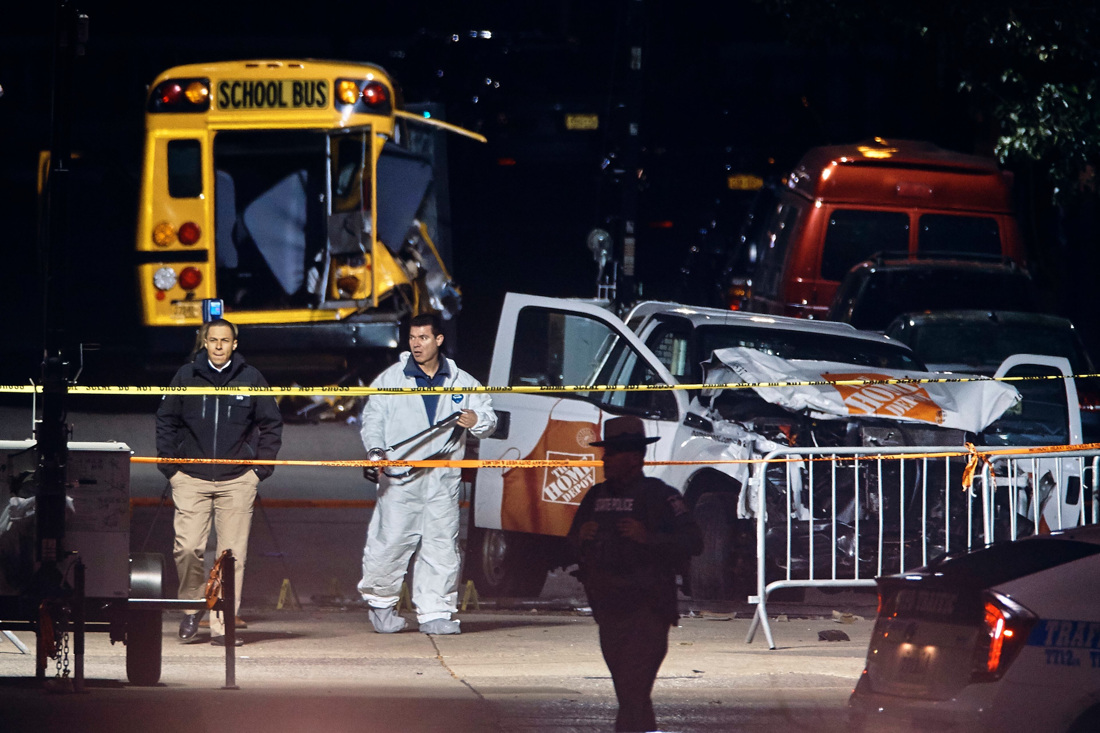 Police work near a damaged Home Depot truck after a motorist drove onto a bike path near the World Trade Center memorial, striking and killing several people, Wednesday, Nov. 1, 2017, in New York. (AP Photo/Andres Kudacki)