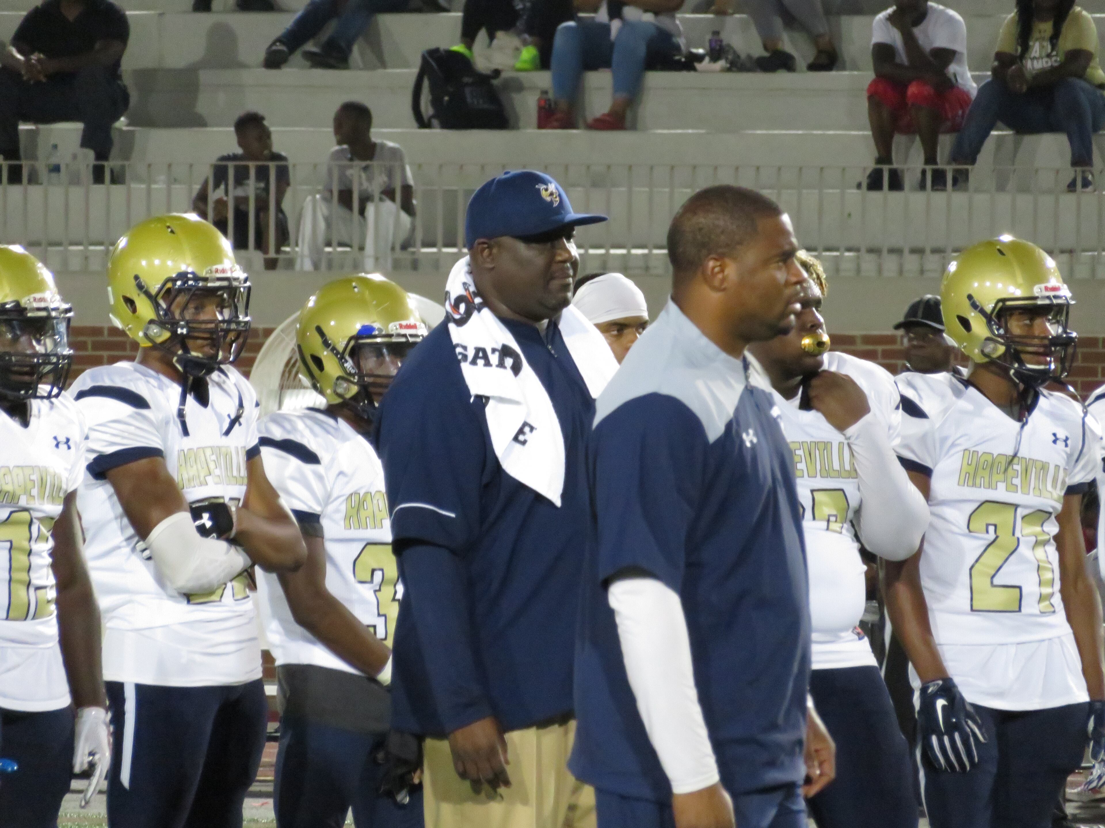Winston Gordon (center, hat) has coached the Hornets since the program's inaugural season in 2011. (Adam Krohn)