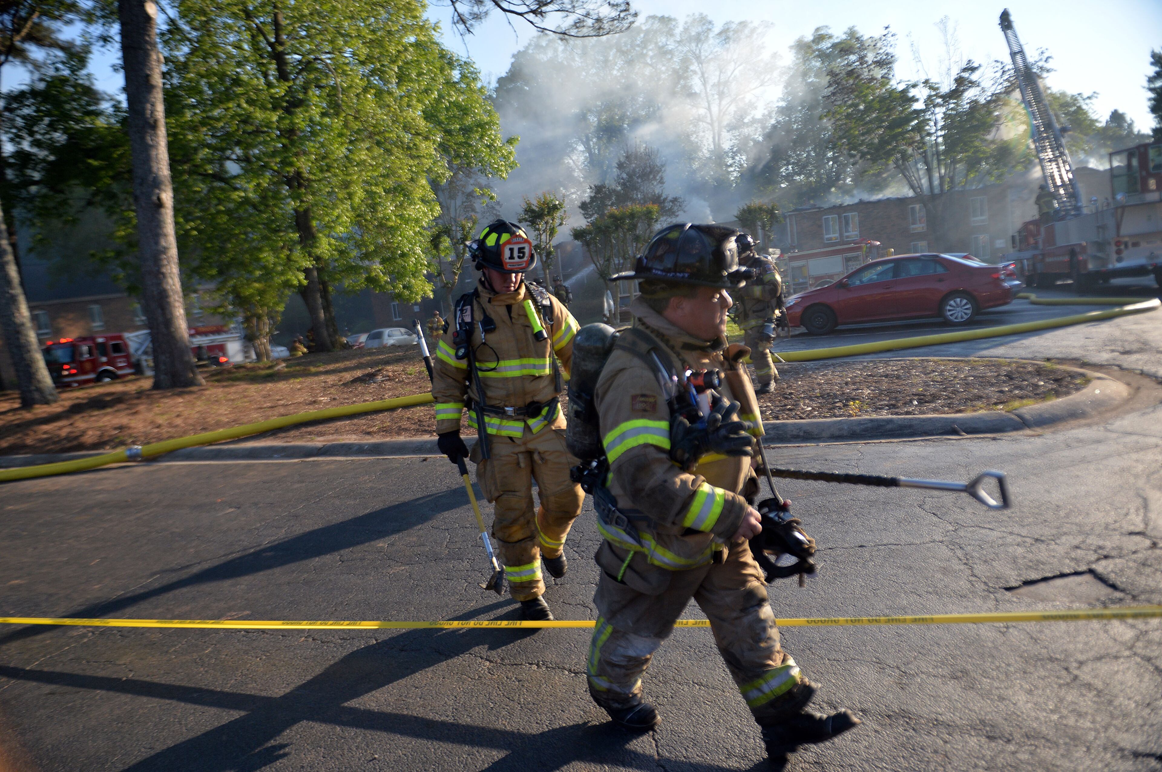 DeKalb County firefighters battle a two-alarm fire at 1413 Druid Valley Road off Briarcliff Road Friday, May 1, 2015. Firefighters pulled back out of the structure after they first arrived due to the amount of fire, according to Deputy Chief Norman Augustin. No injuries to firefighters or residents were reported. KENT D. JOHNSON /KDJOHNSON@AJC.COM