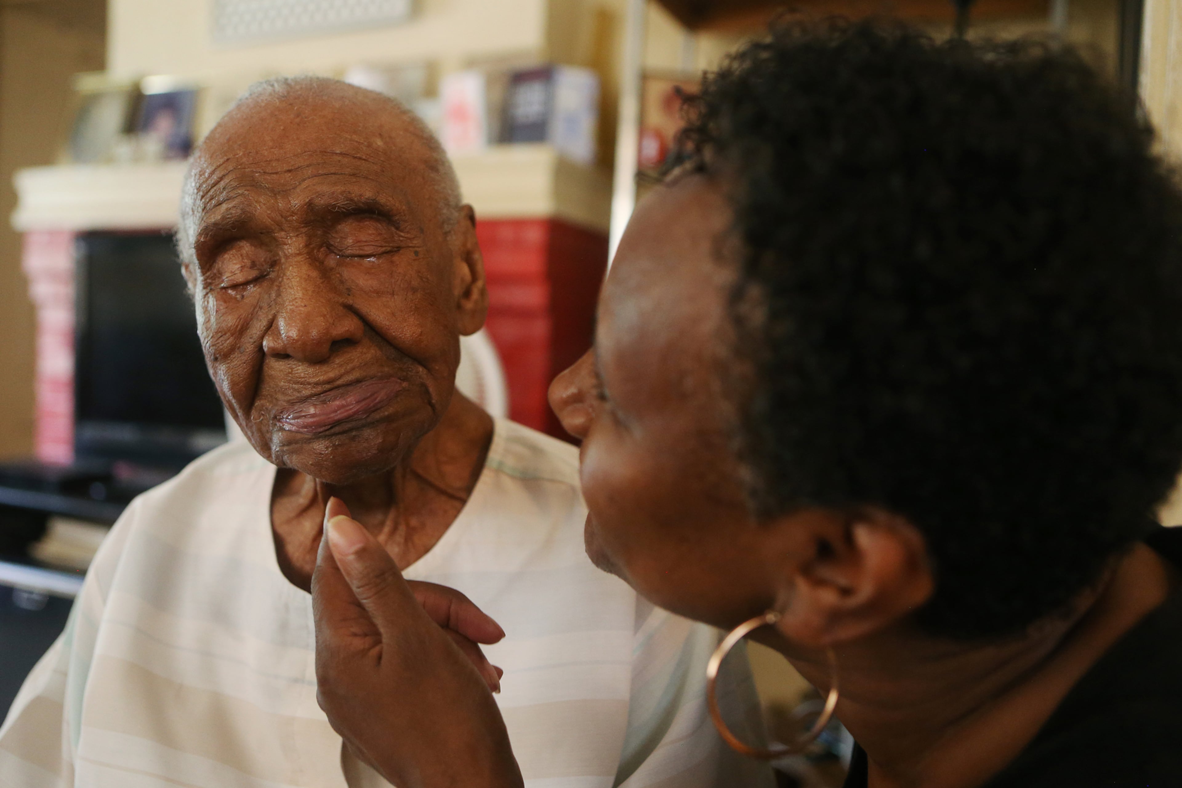 Veronica Edwards "gives some sugar" to her grandmother, Willie Mae Hardy, at their home in Decatur, Georgia on Thursday, July 18, 2019. At 111 years old, Hardy is the oldest living African-American in the United States. Hardy was born in 1908 in Junction City, Georgia, and was the granddaughter of a slave. She moved to Atlanta in 1939 looking for a better life for her and her late daughter, Cassie, and has lived in the city ever since. Edwards is the primary caregiver for Hardy. Hardy had the opportunity to meet former First Lady Michelle Obama during Obama's book tour in May.