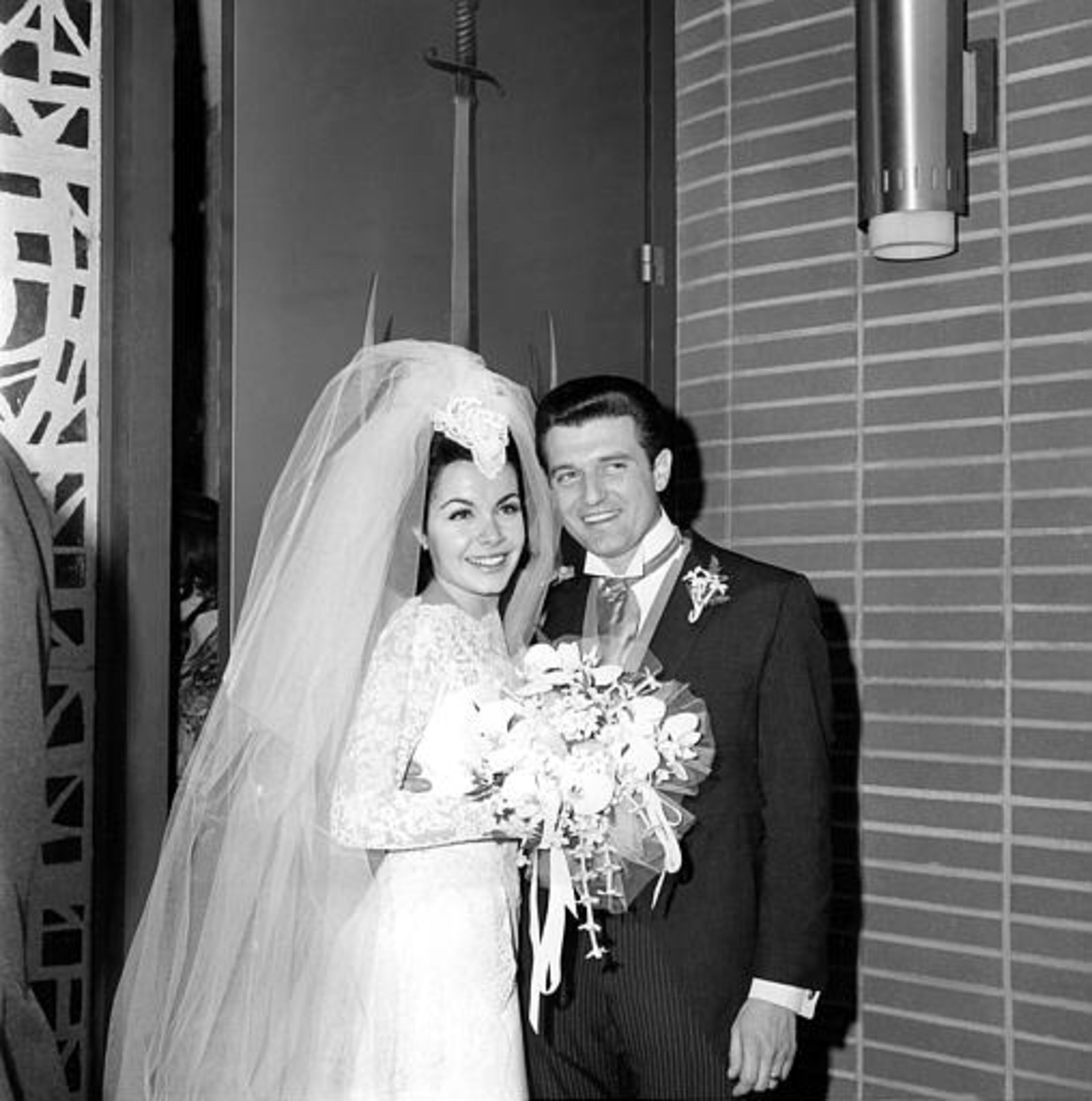 Newlyweds actress Annette Funicello and her groom, motion picture agent Jack Gilardi, are leaving St. Cyril's Roman Catholic Church in Encino, Calif., on January 9, 1965, following their wedding ceremony. (AP Photo)