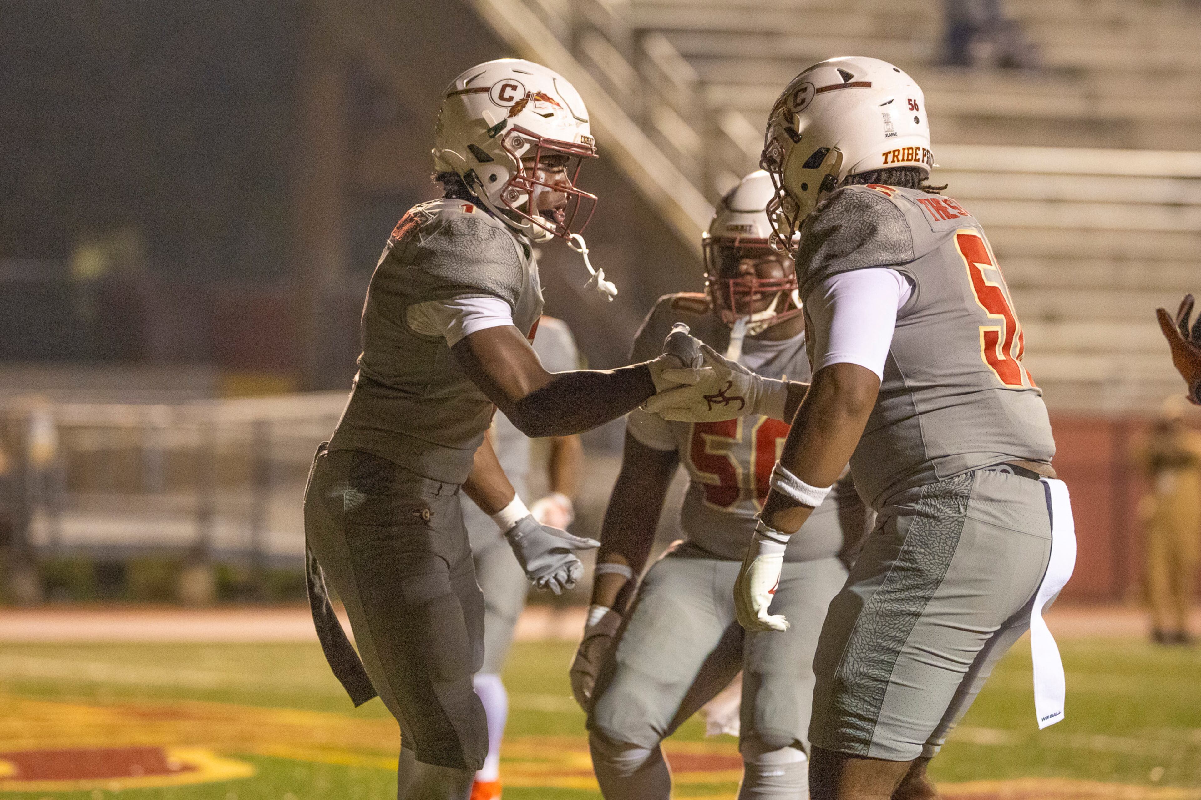Creekside running back Gary Walker (left) celebrates the game-winning touchdown with teammate Jamar Milfort during their Class 4A semifinal against Kell on Friday, Dec. 5, 2025, at Creekside High School in Fairburn. (Oscar Guevara Saenz for the AJC)