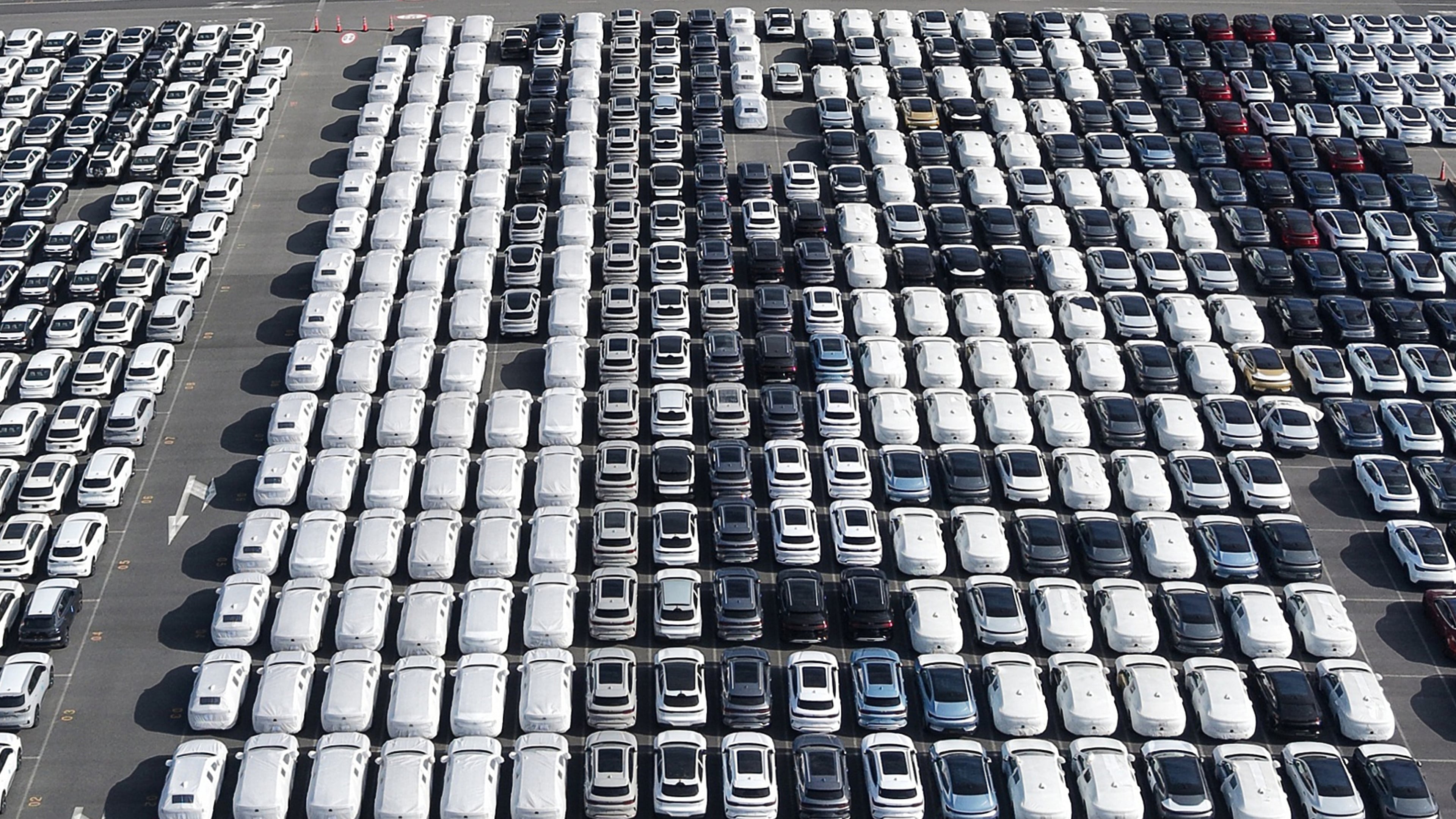 FILE - Aerial view of new cars waiting for shipment at a port in Shanghai, China, on Jan. 14, 2026. (Chinatopix via AP, File)