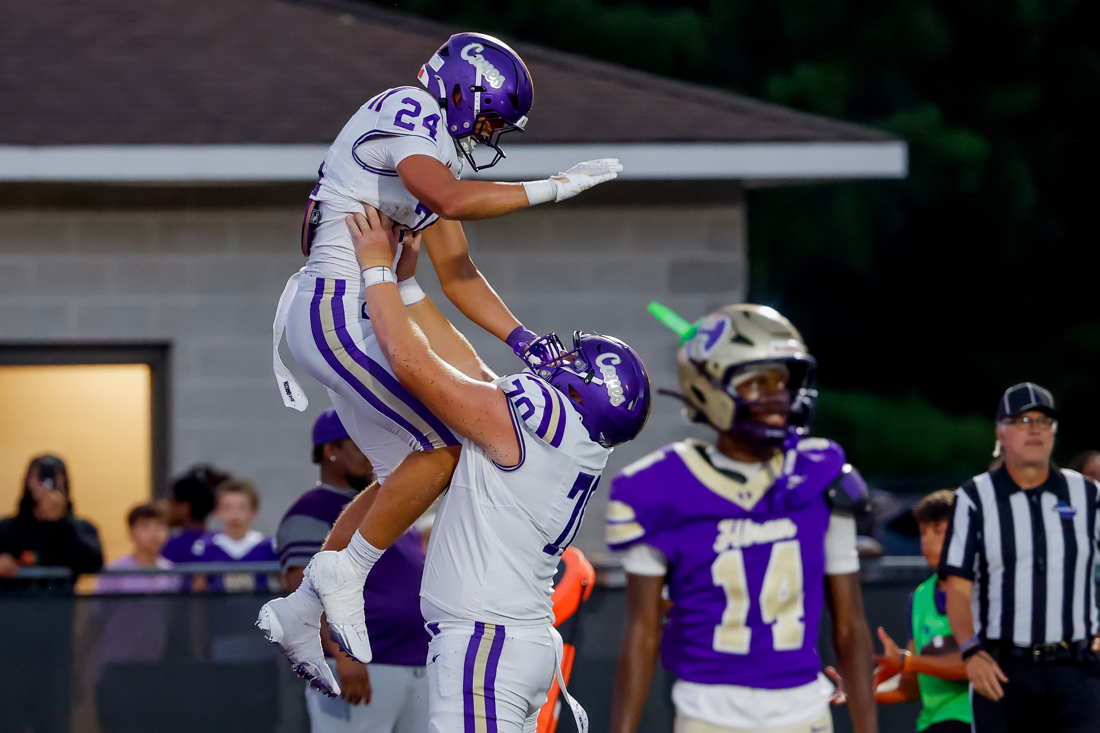 Carterville tight end Cole Crawford (left) celebrates his touchdown against Hiram with offensive lineman Carter Levstek on Friday, Aug. 21, 2026, in Hiram. (Erik S. Lesser for the AJC)