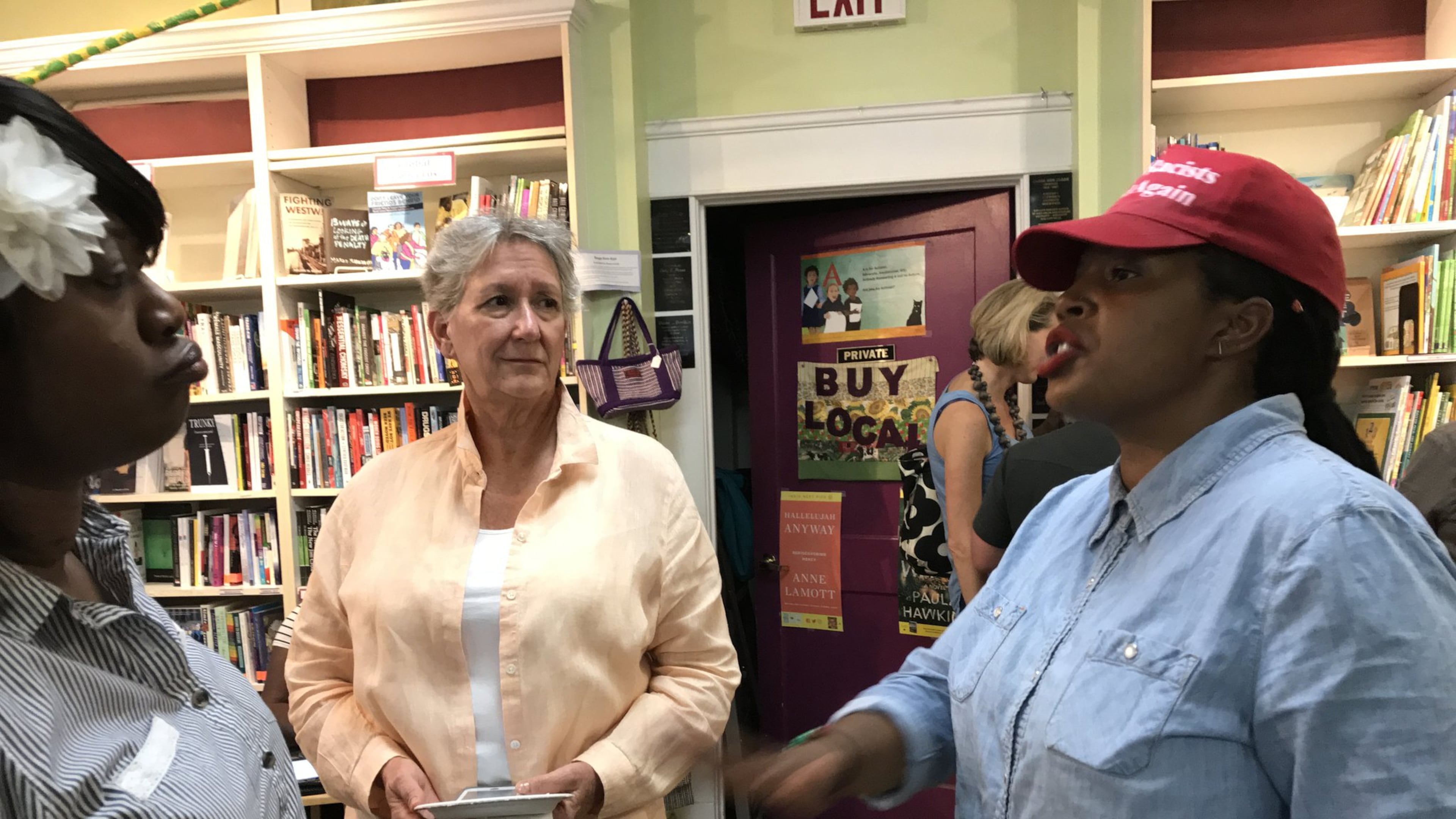 SONG co-director Mary Hooks (far rights) talks with Jessica Sykes, of the Motherless Village of Hope, and Anna Daane of the United Way of Greater Atlanta, about the “Black Mama Bailout” during a fundraiser at Charis Books & More. CREDIT: SHELIA M. POOLE