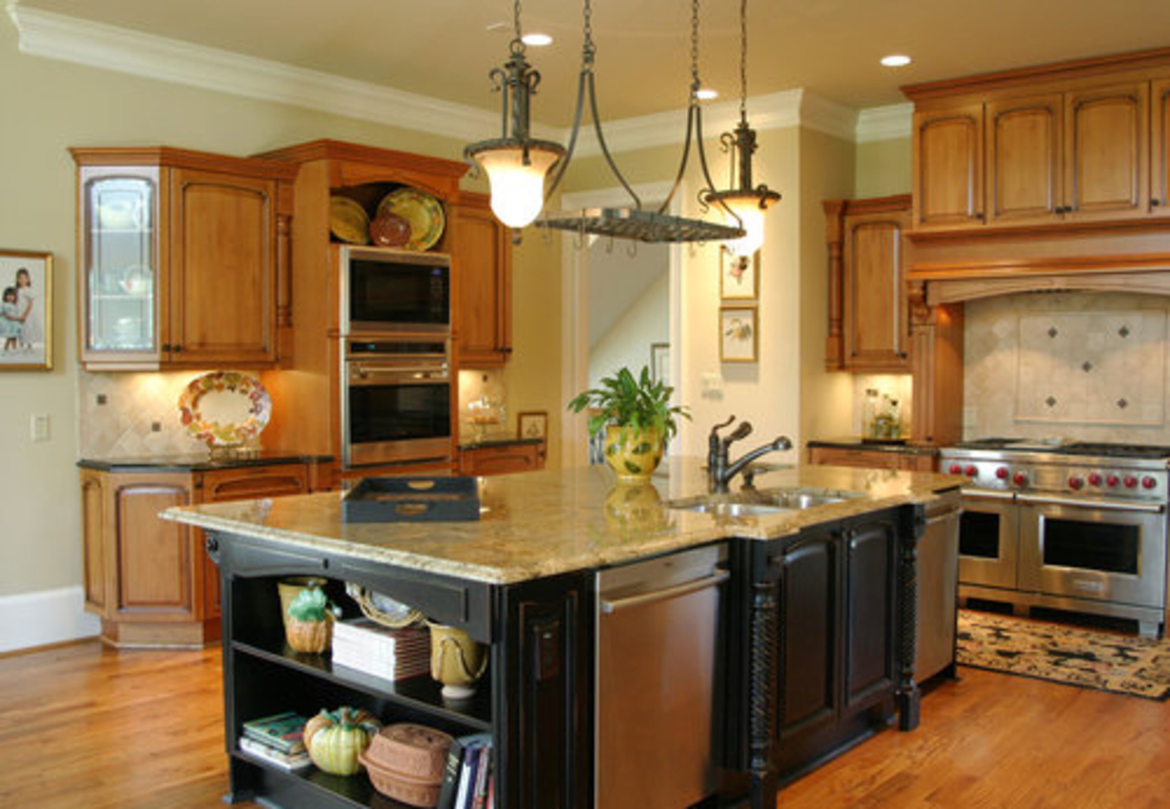 "We do like to entertain," says Lois. "He's the chef in the house, he loves to cook Greek meals. We wanted a big open area to have everybody involved." Tom adds: "Lamb and potatoes is my favorite dish to make." The kitchen features LUBE Italian cabinets, a double dishwasher, wine cooler and Wolf gas range.