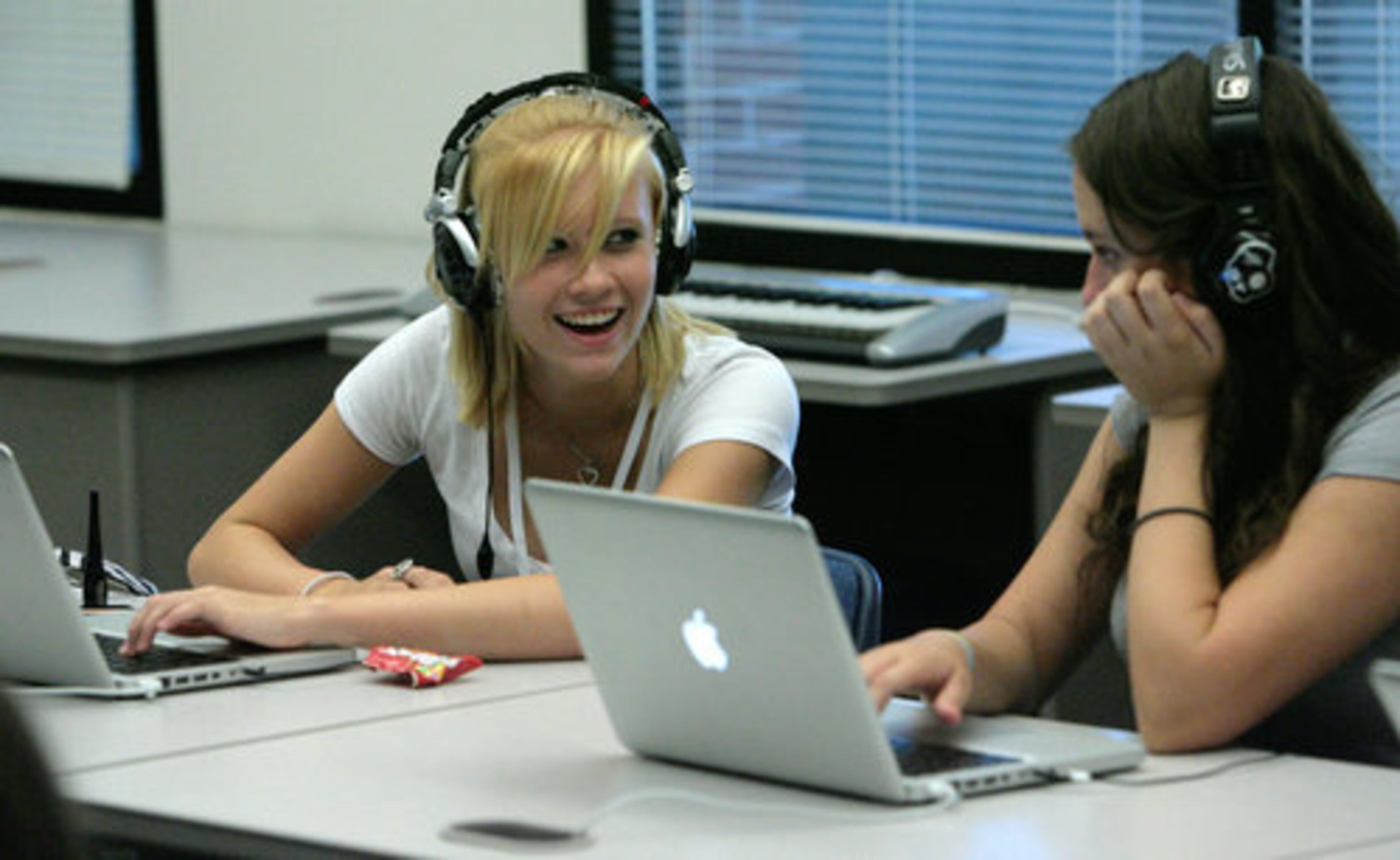 Amber Martin, 15, from Dallas, and Ashton Brooks, 15, from Cartersville, learn to use a virtual keyboard in the digital music class.