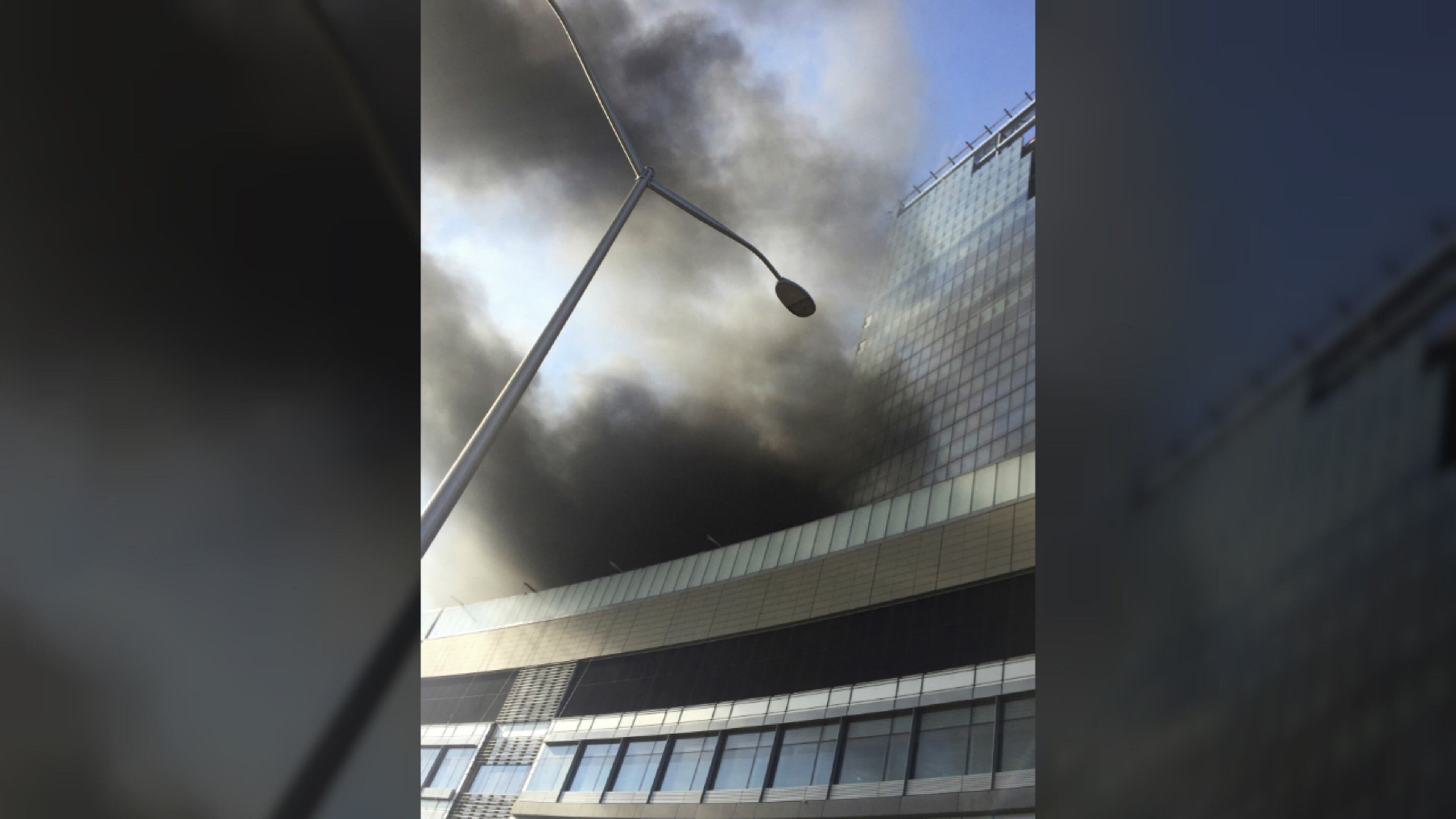 Smoke rises from a building under construction at the NYU Langone Medical Center on the east side of Manhattan in New York, Wednesday, Dec. 14, 2016. (AP Photo/Andres Kudacki)