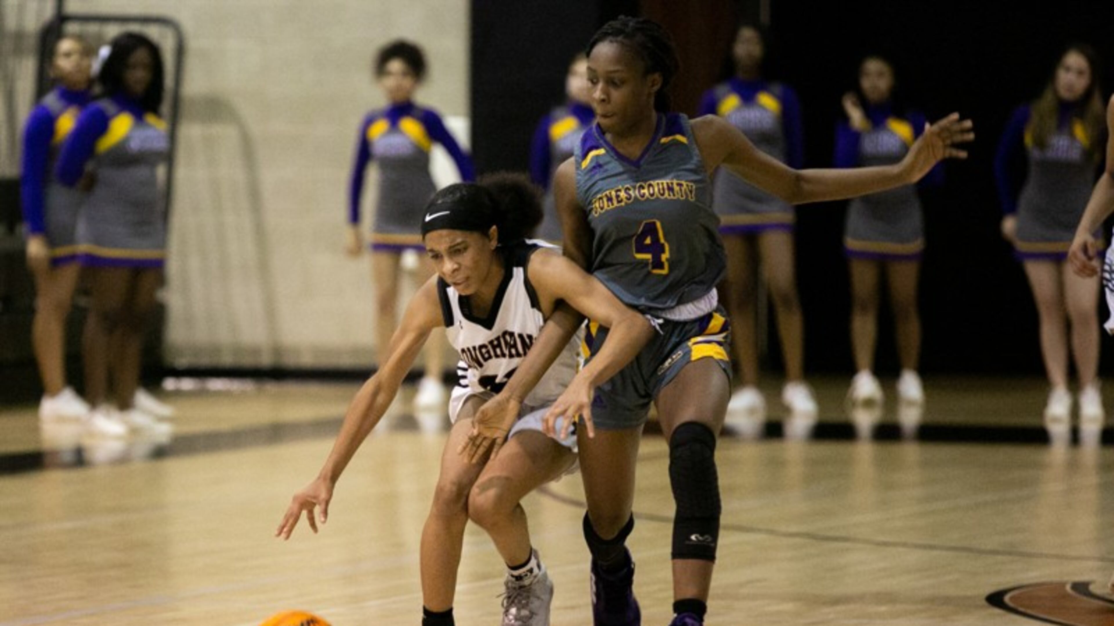 Kell High School's Crystal Henderson (right) reaches for the ball with against Jones County's Sikoya Hogan (4) in the 2020 state playoffs.