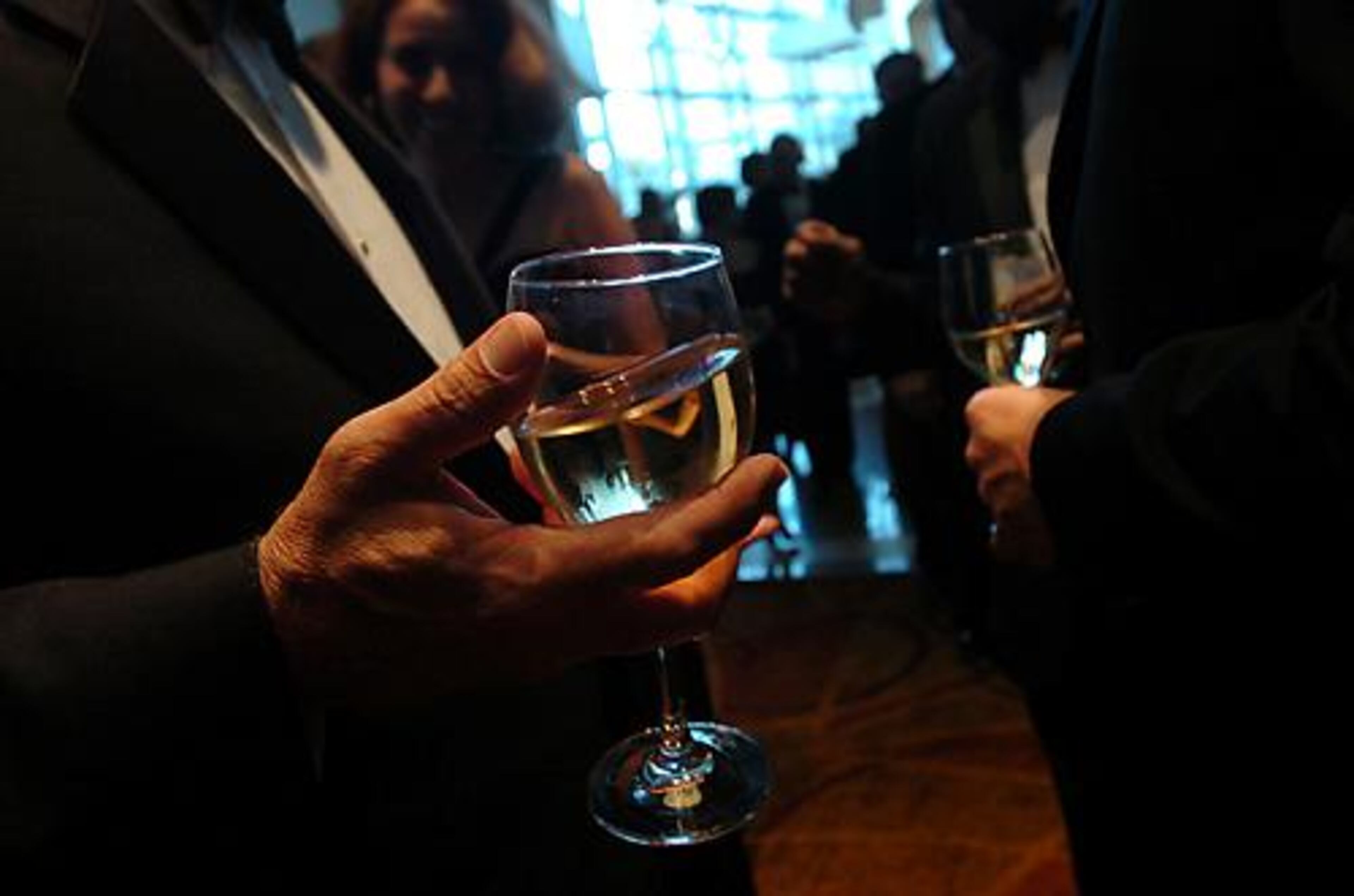 Dick Smith (left) and Robert Jordan mingle in the lobby during the opening-night gala.
