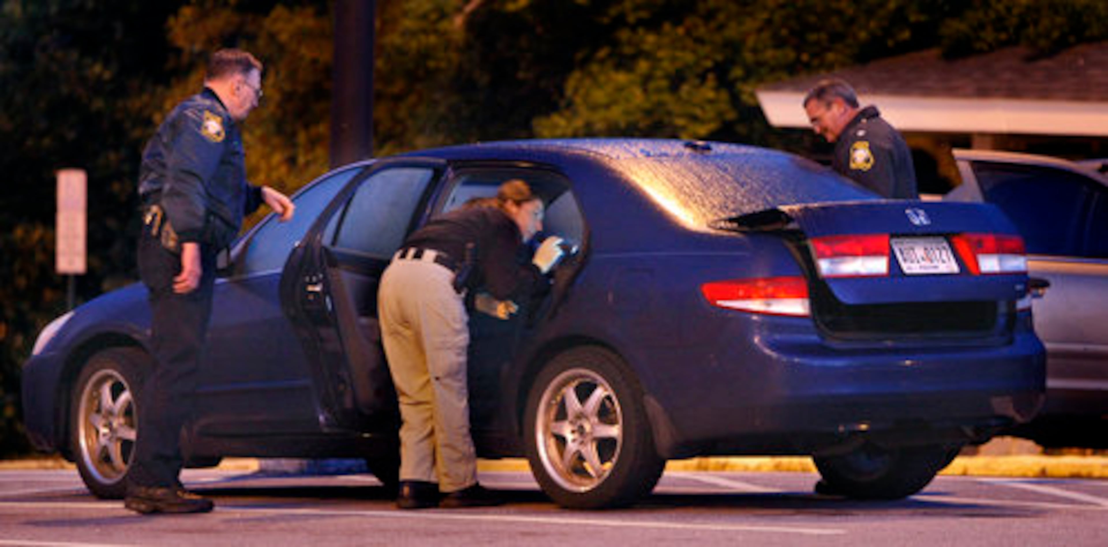 Edge's blue Honda was found, still in the Confederate Hall parking lot. Stone Mountain police and GBI look over the car Wednesday morning.