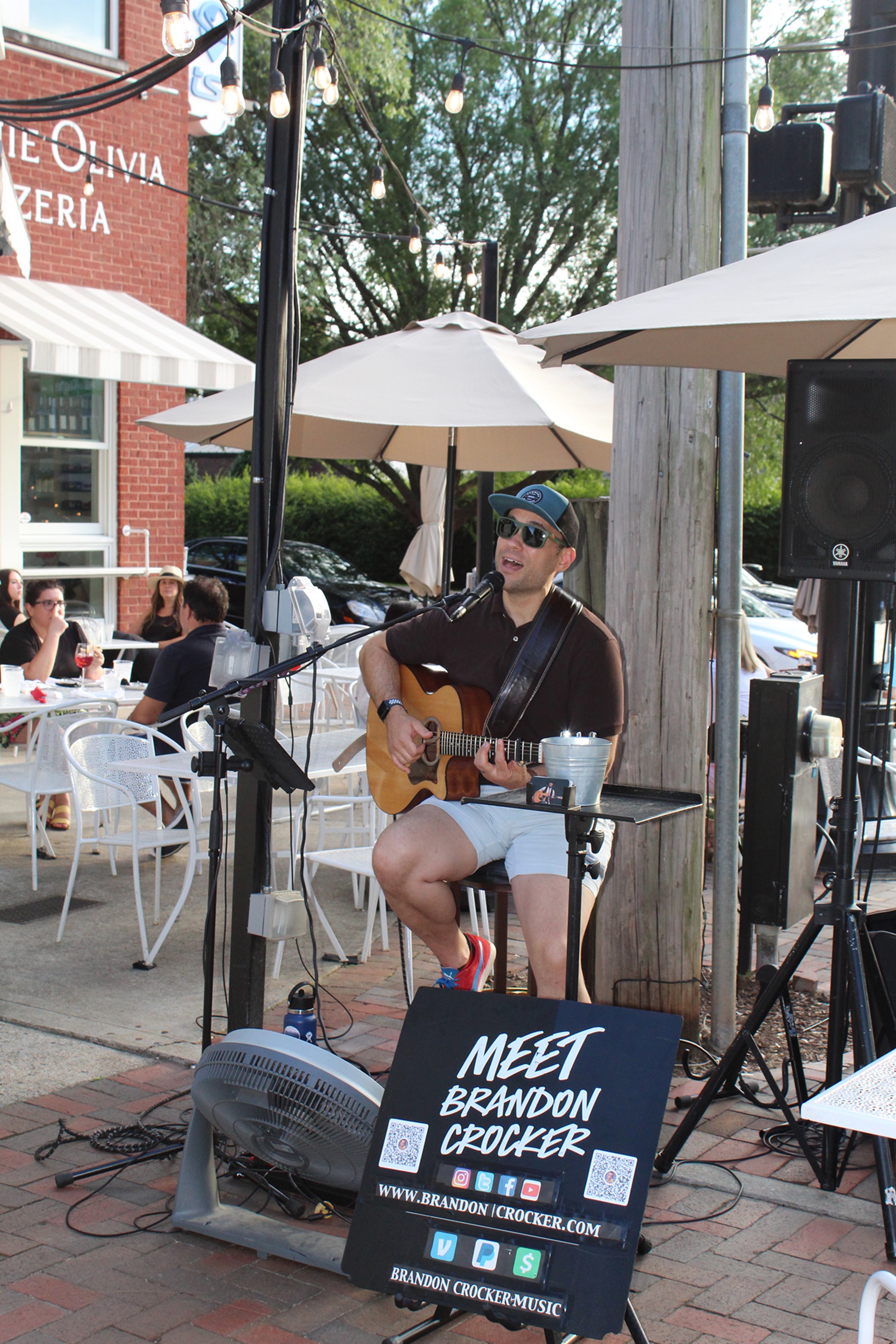 Brandon Crocker performs in the courtyard between Fogón and Lions, a Spanish and Latin eatery, and Minnie Olivia Wood Fire Pizzeria in Alpharetta.
Photo: Courtesy of Gracie Waylock