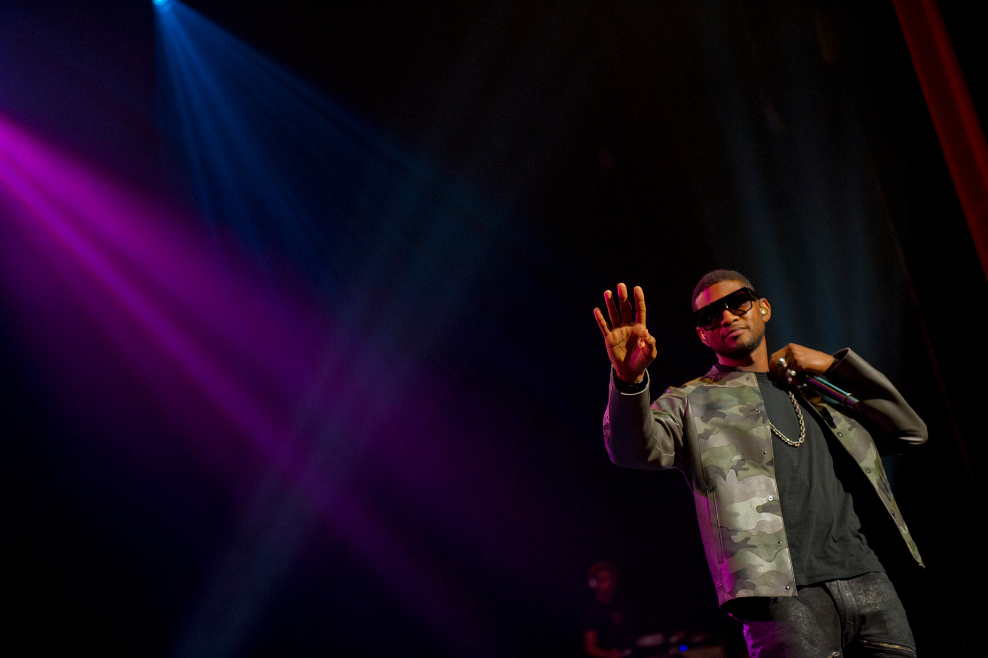 Usher performs onstage at the Fox Theatre in Atlanta during the So So Def 20th Anniversary Concert Saturday, Feb. 23, 2013.