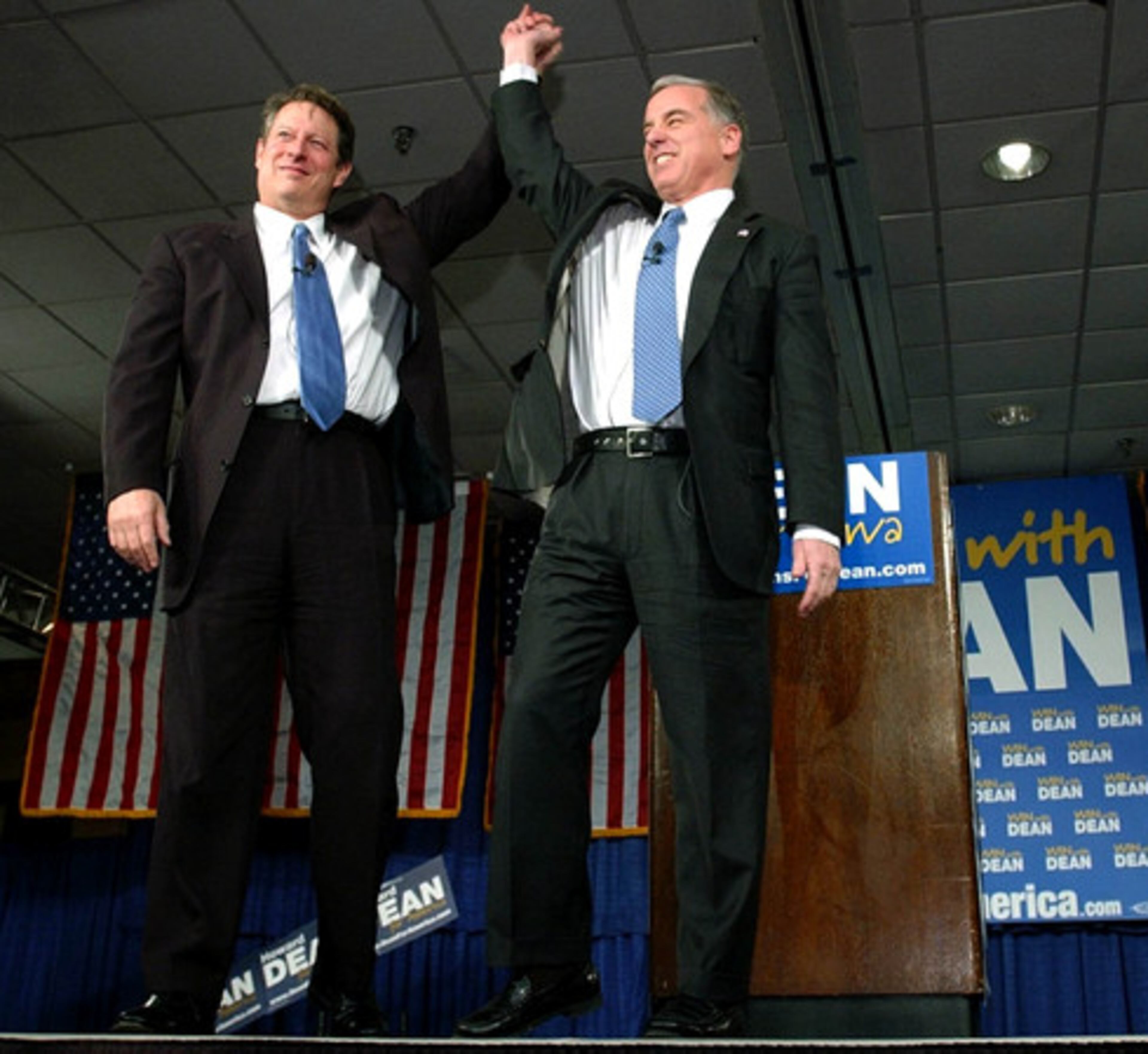Former Vice President Al Gore raises hands with Democratic presidential hopeful Howard Dean, right, in Dec. 2003, in Cedar Rapids, Iowa. Gore endorsed Dean for the Democratic presidential nomination, urging Democrats to unite behind the front-runner.
