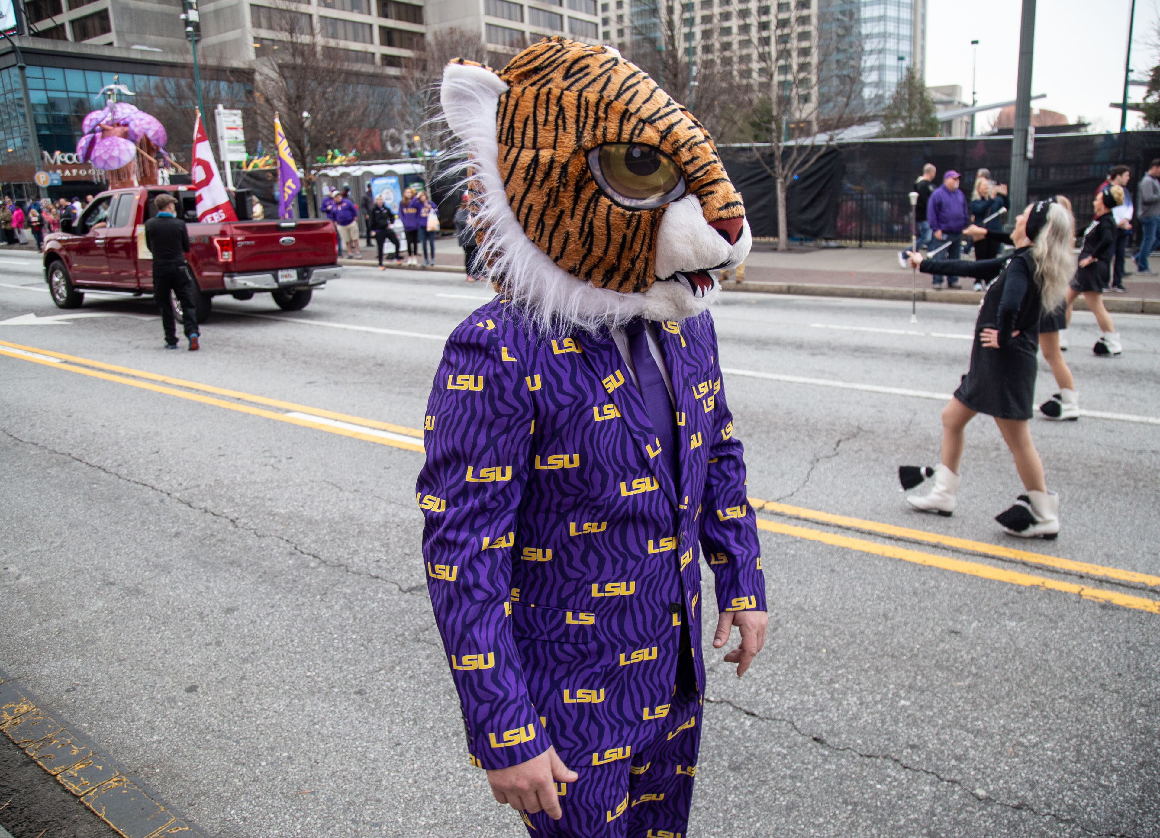 Jonathan Ewing watches the Chick-fil-A Peach Bowl Parade in Atlanta on Saturday, December 28, 2019. STEVE SCHAEFER / SPECIAL TO THE AJC
