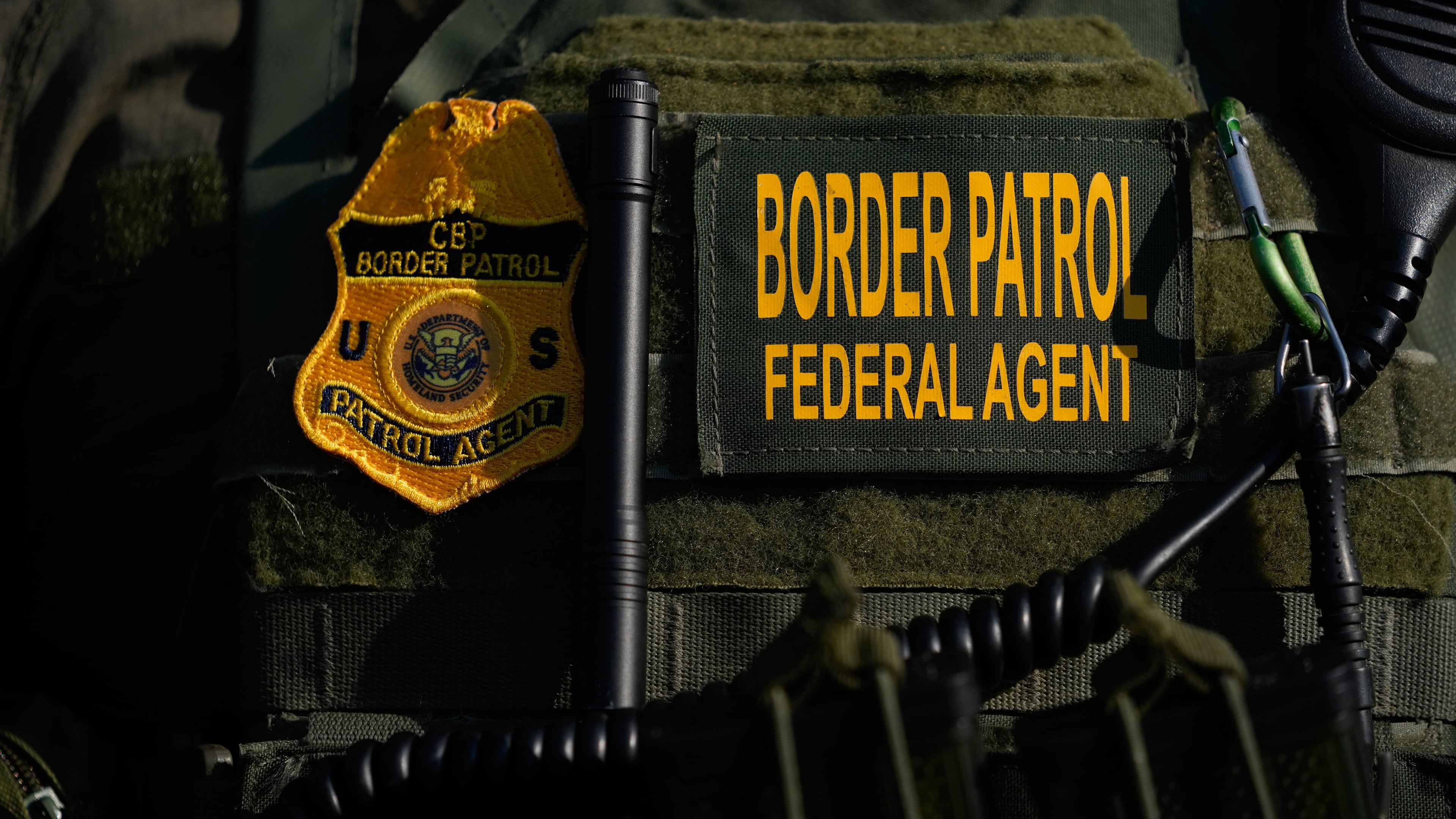 FILE - A Federal Patrol agent's badge is seen near an Immigration and Customs Enforcement facility in Broadview, Ill., Oct. 3, 2025. (AP Photo/Erin Hooley, File)