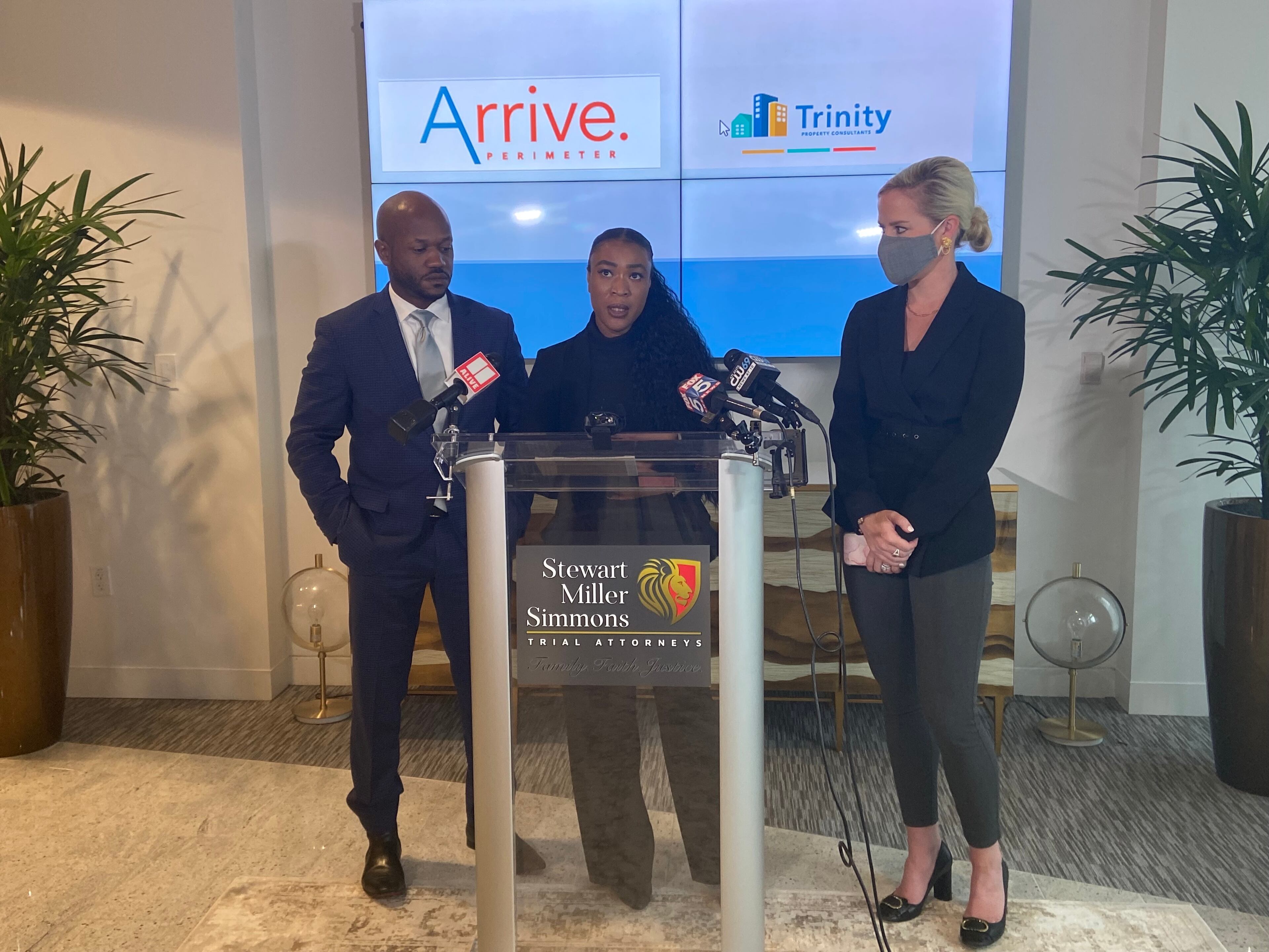 Jasmine Johnson (center) speaks about the explosion Thursday morning along with two of her attorneys.