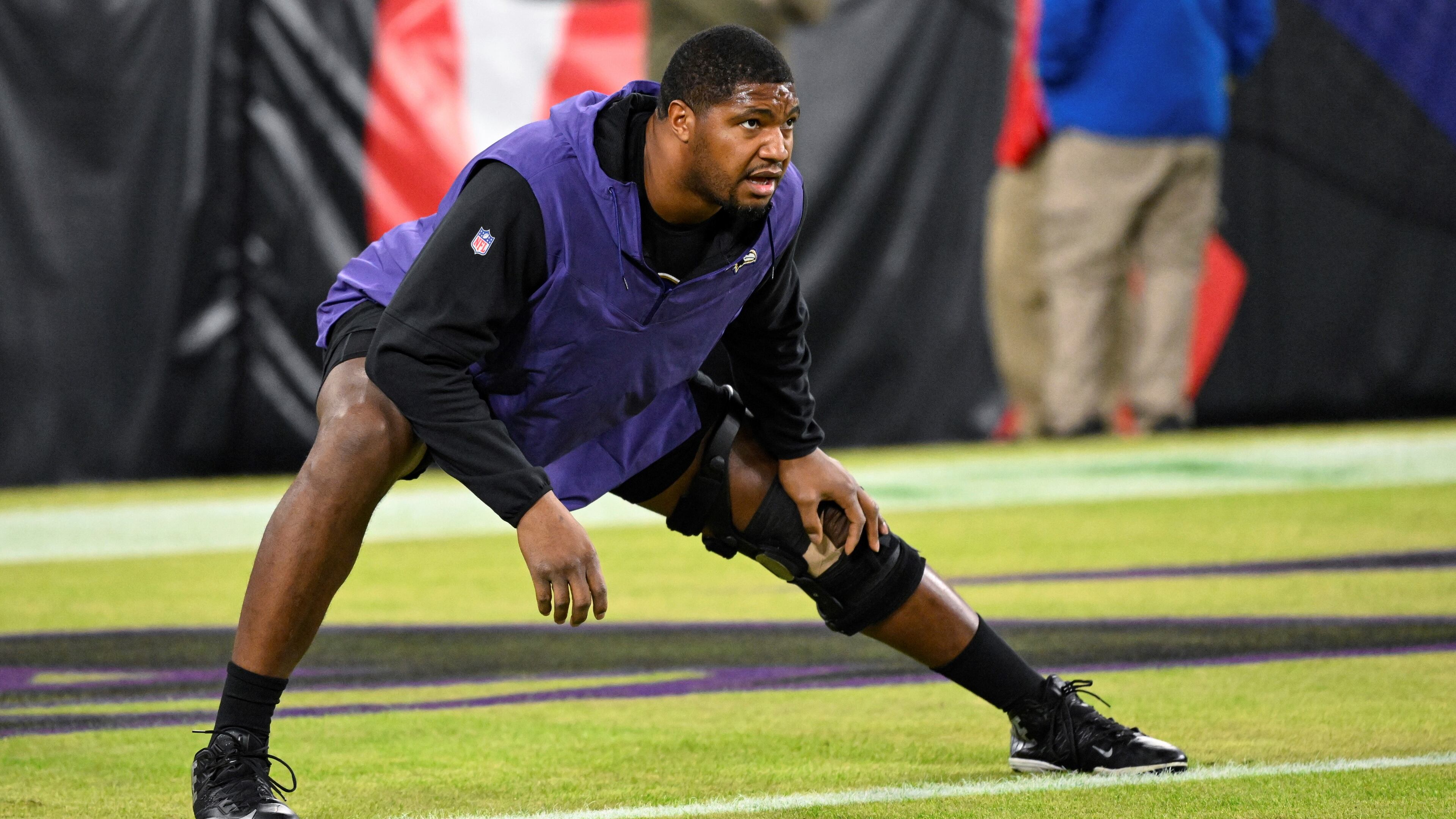 Baltimore Ravens defensive tackle Calais Campbell stretches during pre-game warm-ups before an NFL football game against the Pittsburgh Steelers, Jan. 1, 2023, in Baltimore.