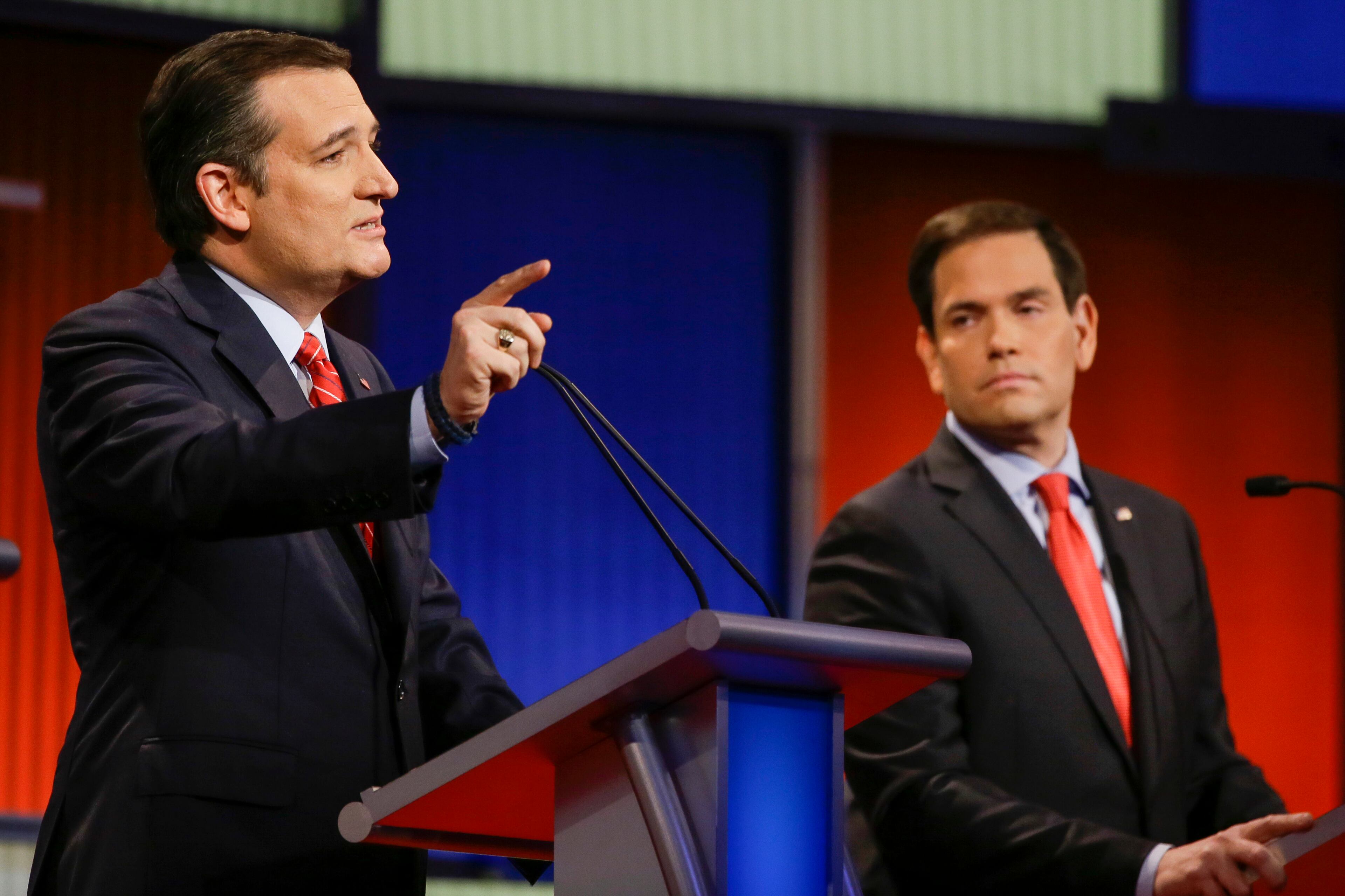 Republican presidential candidate Sen. Ted Cruz, R-Texas, answers a question as Sen. Marco Rubio, R-Fla., looks on during a Republican presidential primary debate, Thursday, Jan. 28, 2016, in Des Moines, Iowa. (AP Photo/Charlie Neibergall)