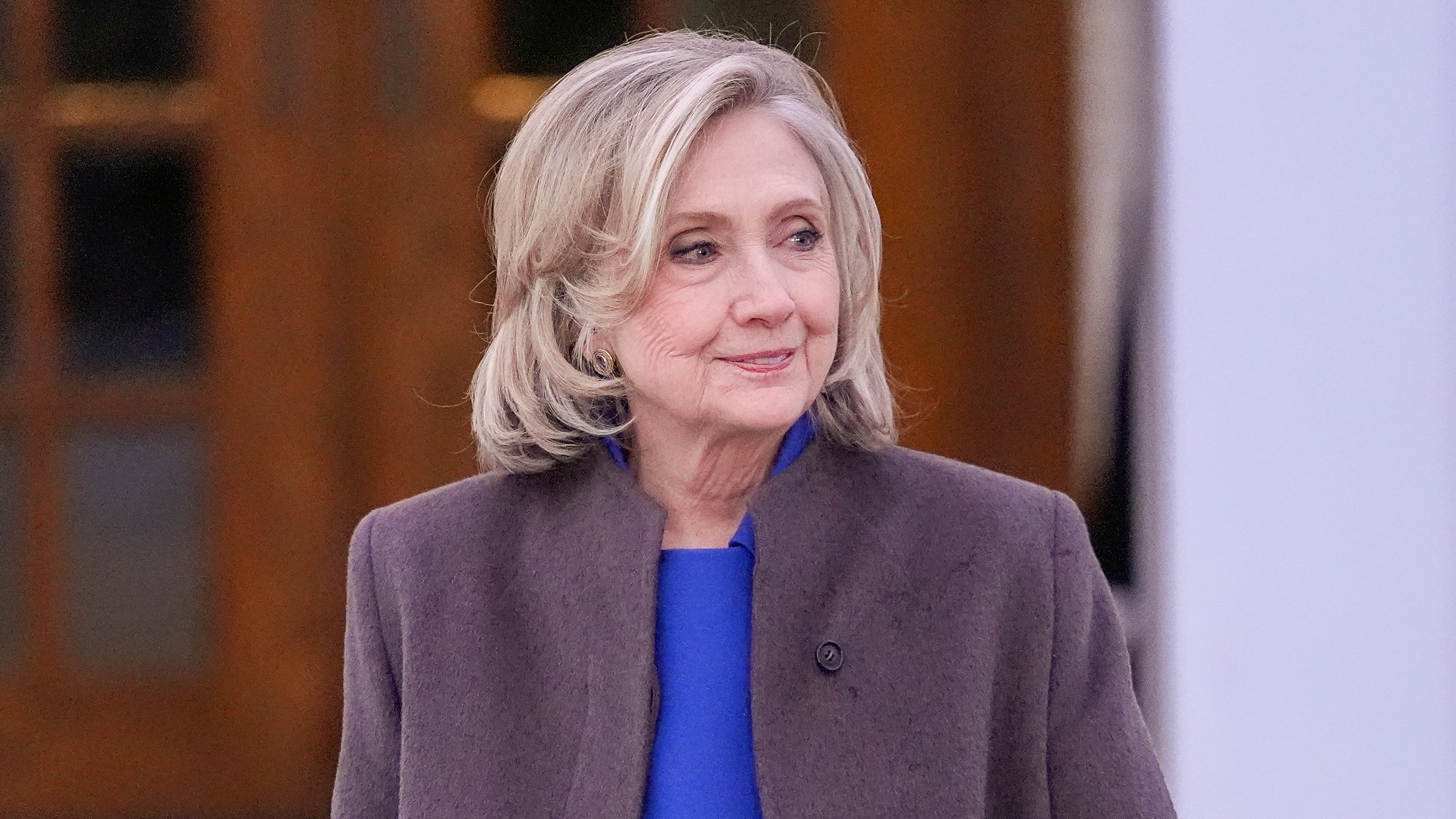 FILE - Former Secretary of State Hillary Clinton walks outside the Chappaqua Performing Arts Center, after testifying before U.S. House lawmakers as part of a congressional investigation into convicted sex offender Jeffrey Epstein, Thursday, Feb. 26, 2026, in Chappaqua, N.Y. (AP Photo/Yuki Iwamura, File)