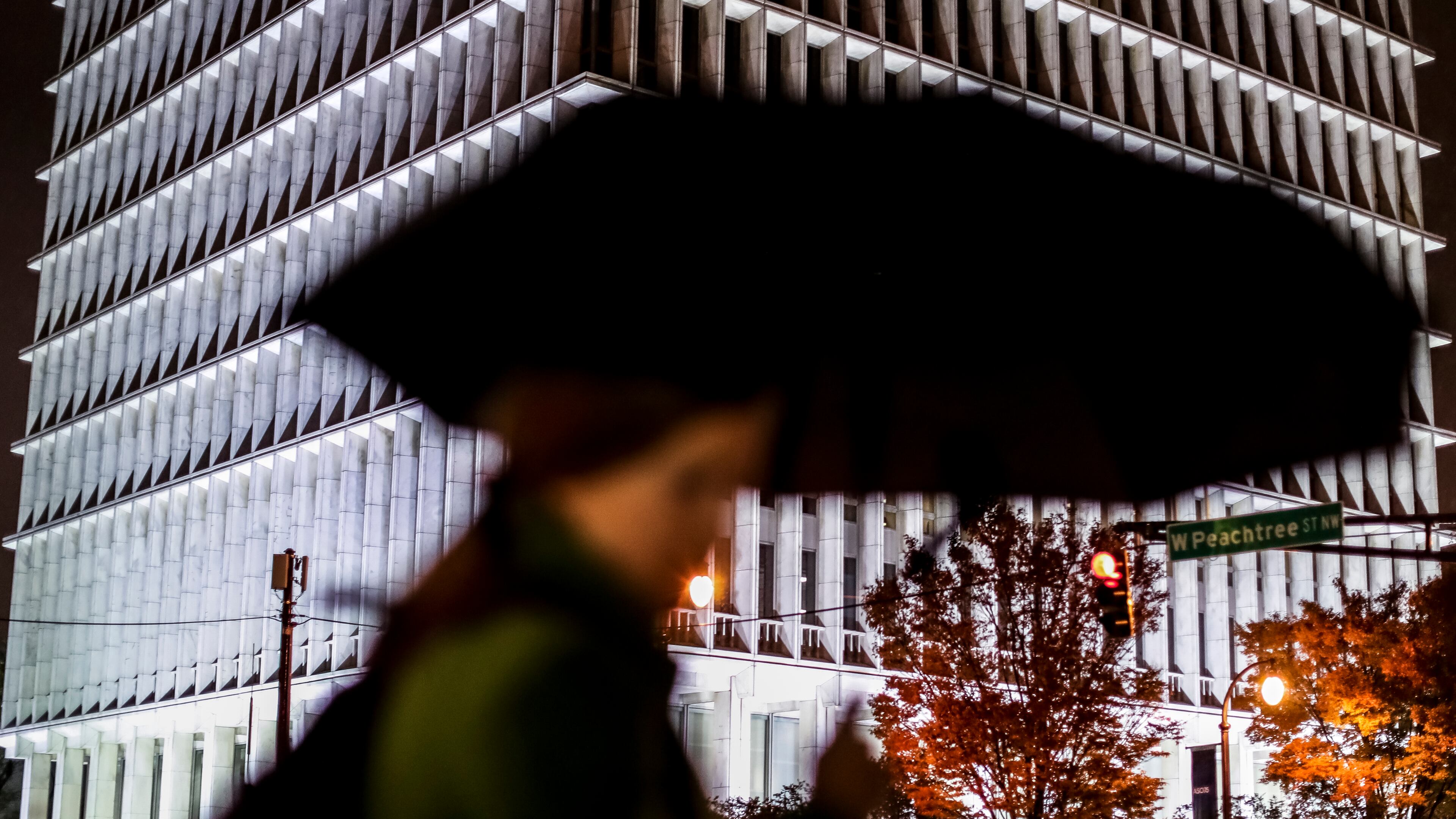 Commuters at the North Avenue MARTA station came with umbrellas in hand crossing West Peachtree Street at North Avenue as rain hampered commuters Tuesday morning, Nov.12, 2019.