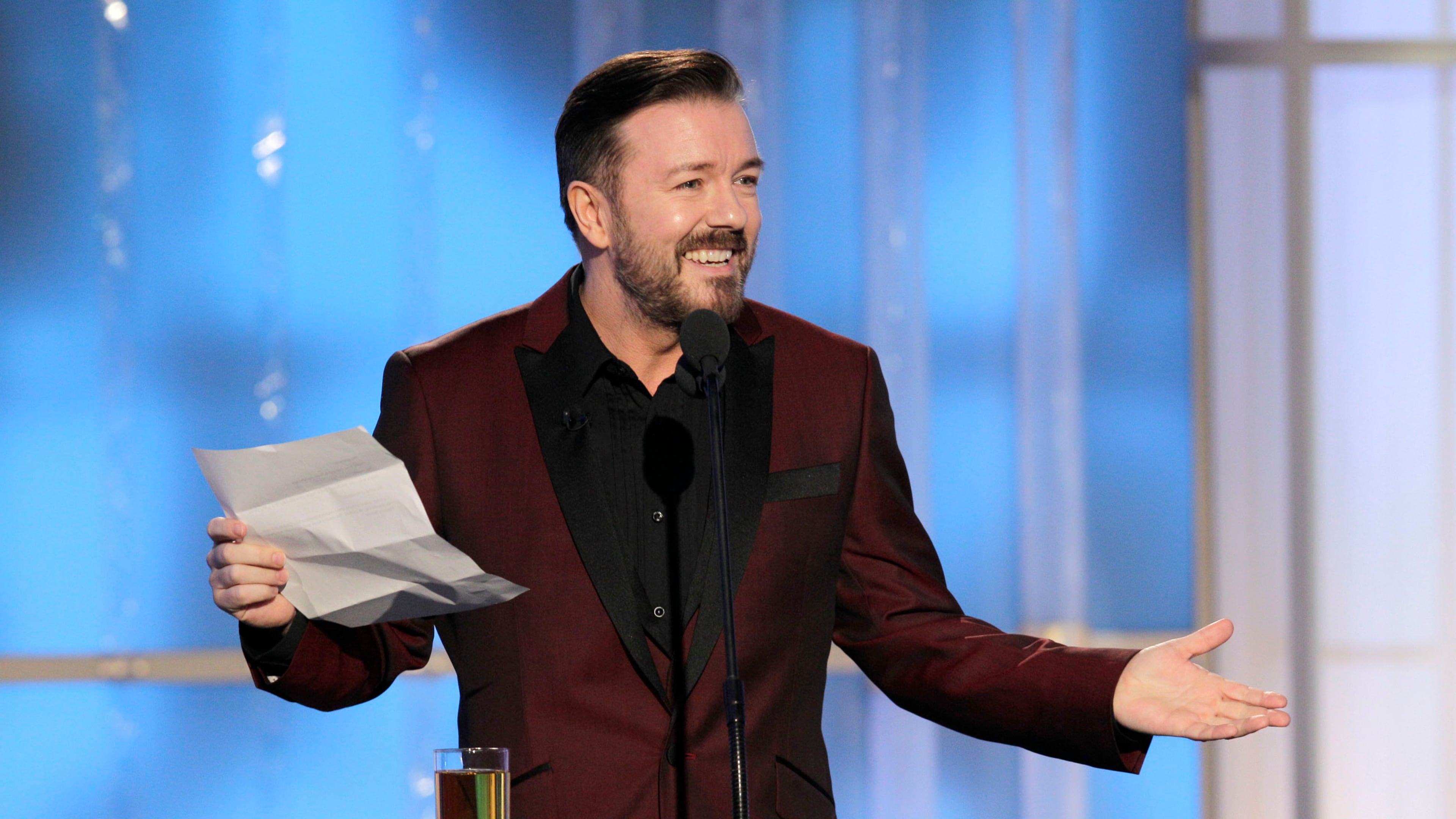 BEVERLY HILLS, CA - JANUARY 15: In this handout photo provided by NBC, host Ricky Gervais performs onstage during the 69th Annual Golden Globe Awards at the Beverly Hilton International Ballroom on January 15, 2012 in Beverly Hills, California. (Photo by Paul Drinkwater/NBC via Getty Images)