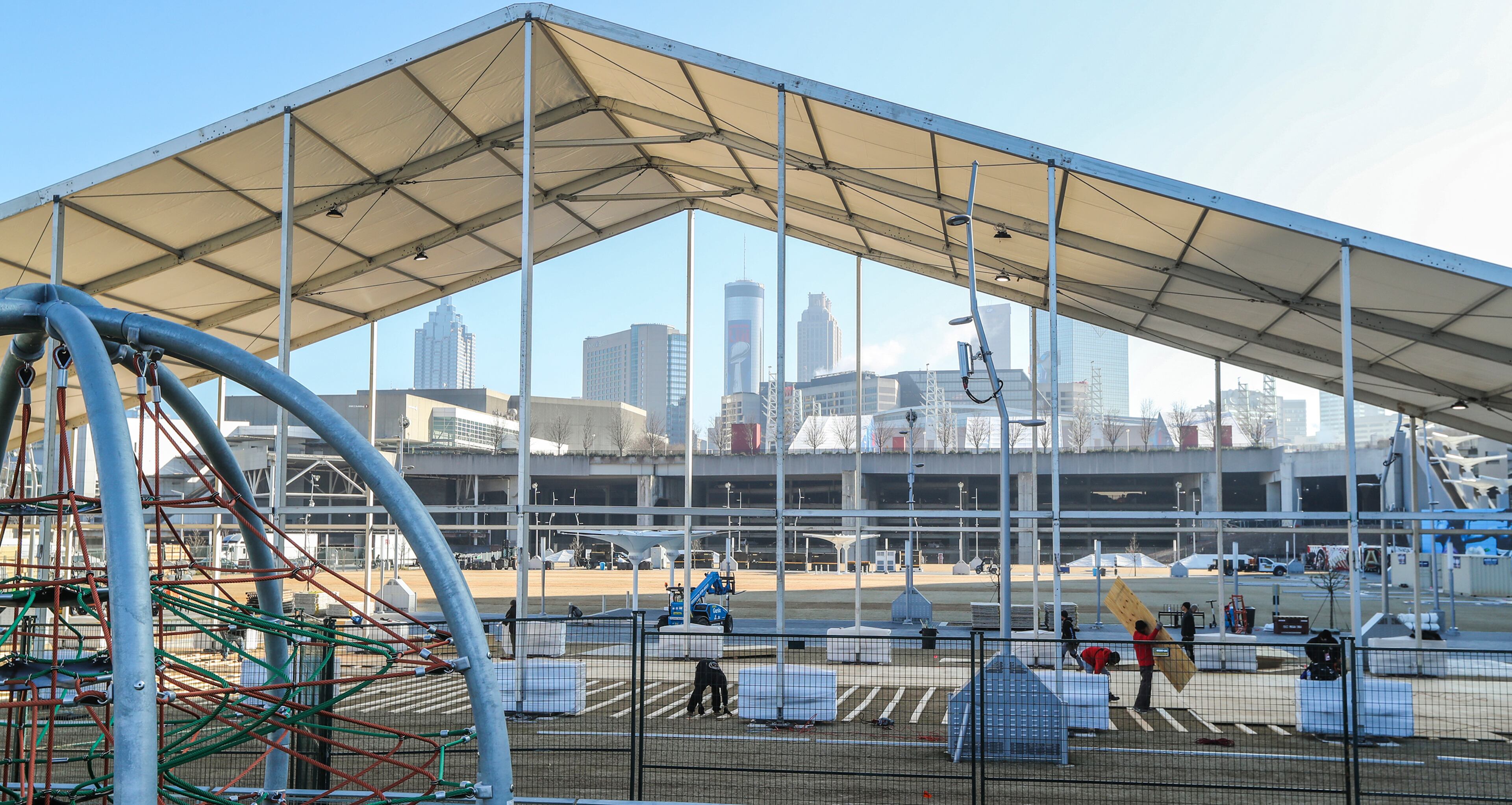 January 16, 2019 Atlanta: Workers prepare a rising structure at The Home Depot Backyard next to Mercedes Benz stadium as structures and Super Bowl graphics are popping up everywhere across Atlanta as evident on Wednesday, Jan. 16, 2019 as the city prepares to host Super Bowl 53. Atlanta faces a test on Super Bowl Sunday and the question with less than a month to go before the big game is this: Is the city ready? The city budgeted some $10 million last year for police, fire and other items to assist with the big game. JOHN SPINK/JSPINK@AJC.COM
