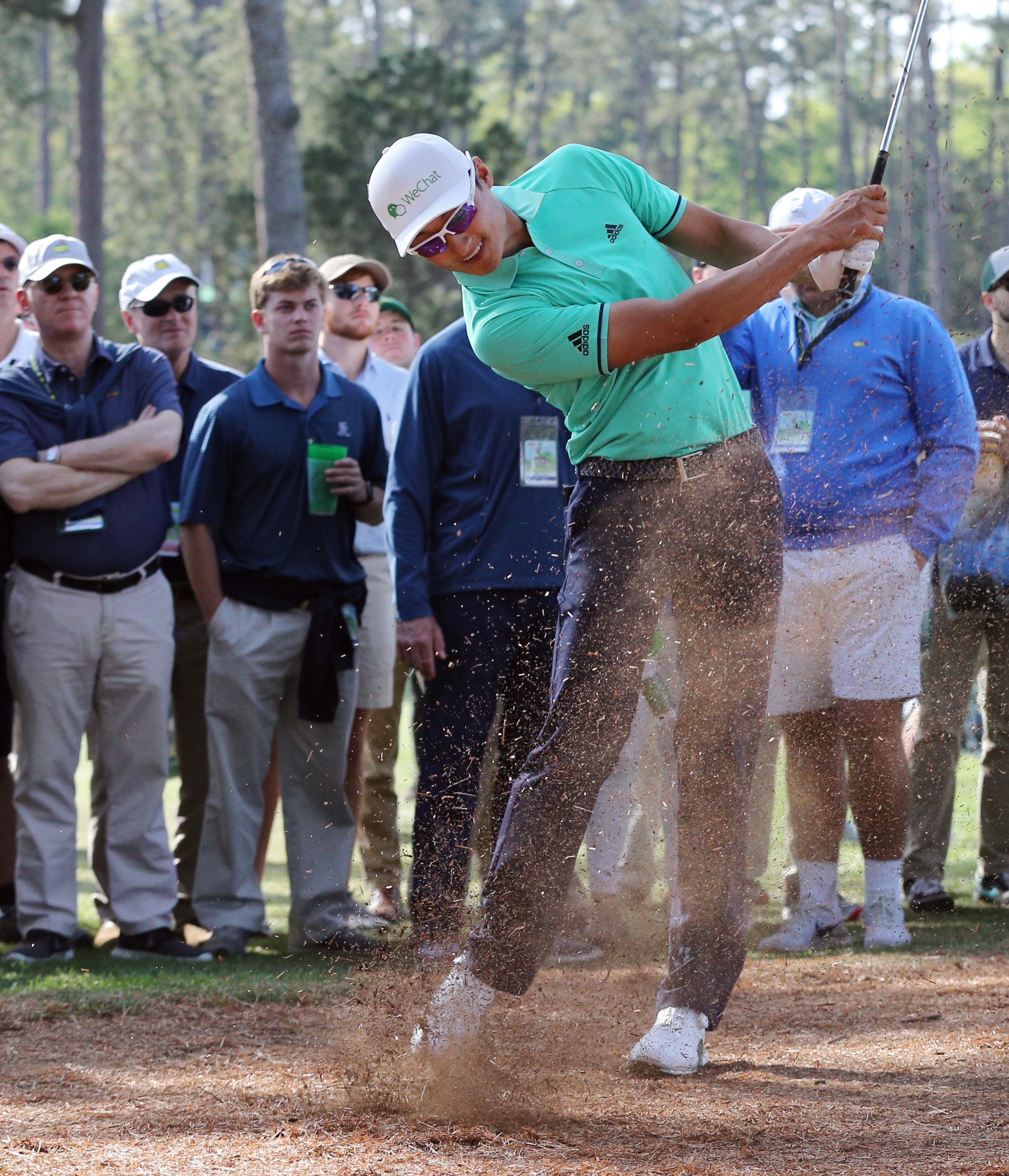 4/5/18 - Augusta - Haotong Li hits his fairway shot on 17 during the first round of the Masters at Augusta National Golf Club on Thursday, April 5, 2018, in Augusta. Curtis Compton/ccompton@ajc.com